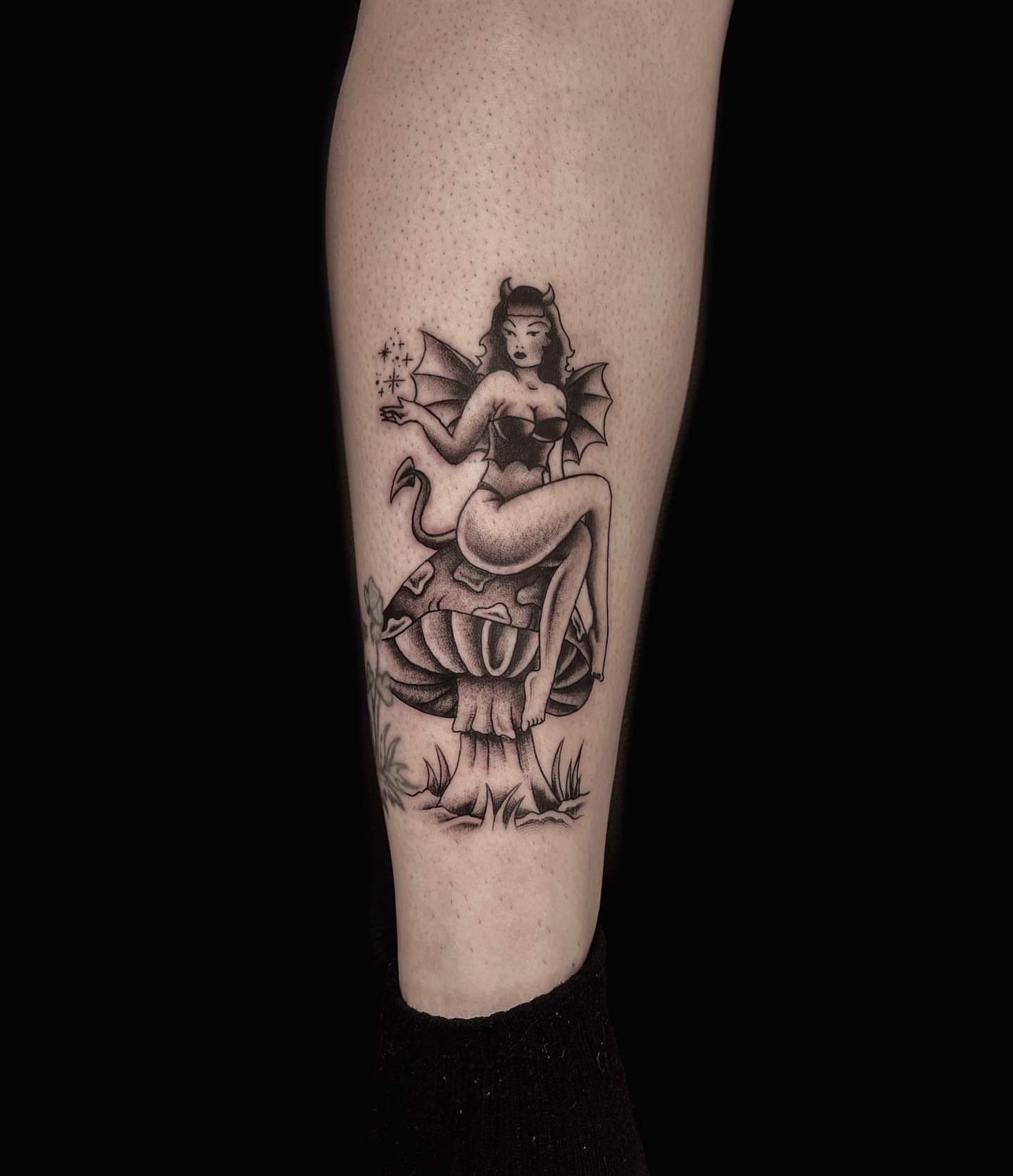 Fairy on mushroom black and grey tattoo on the forearm by Jason