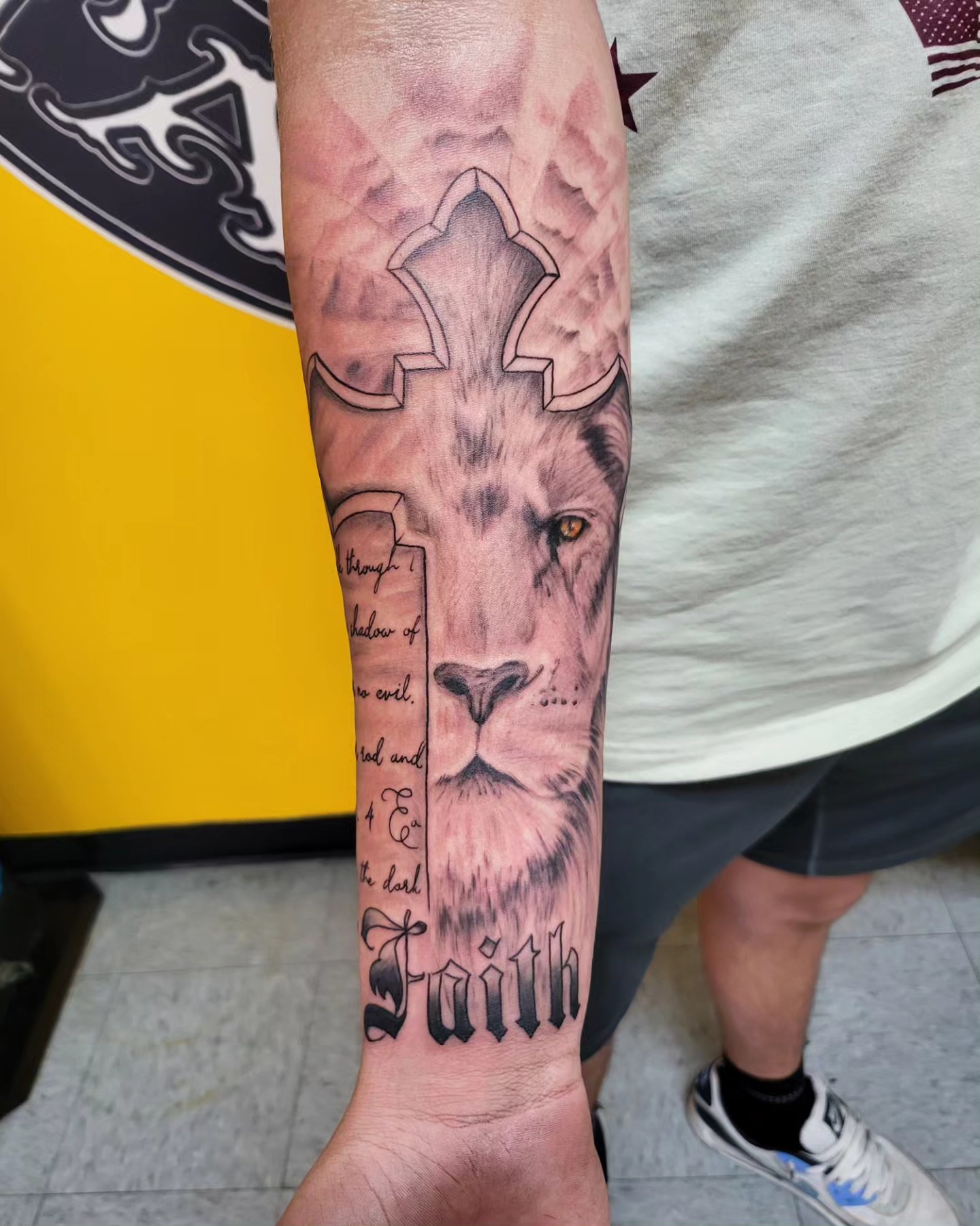 Lion realism tattoo on the forearm by Mike Stamper