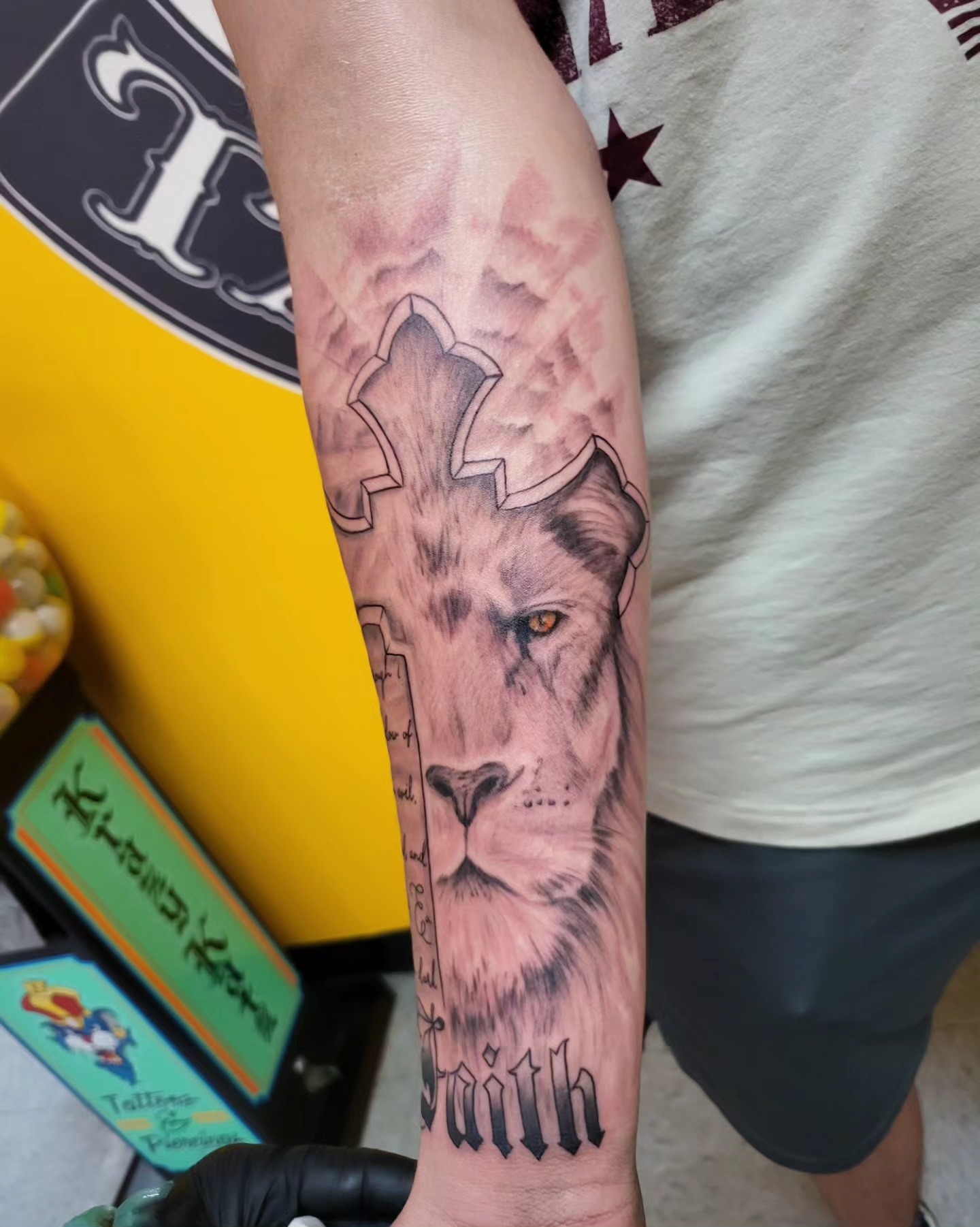 Lion realism tattoo on the forearm by Mike Stamper