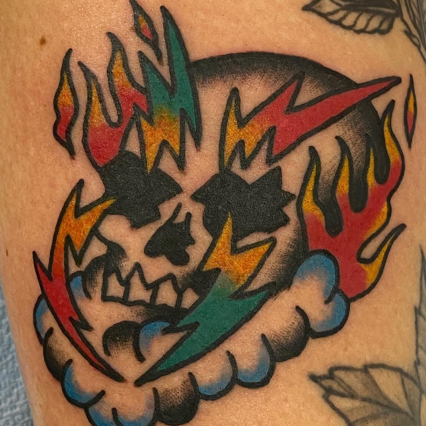 Flaming skull American traditional tattoo on the forearm by Dorian Grey Baker