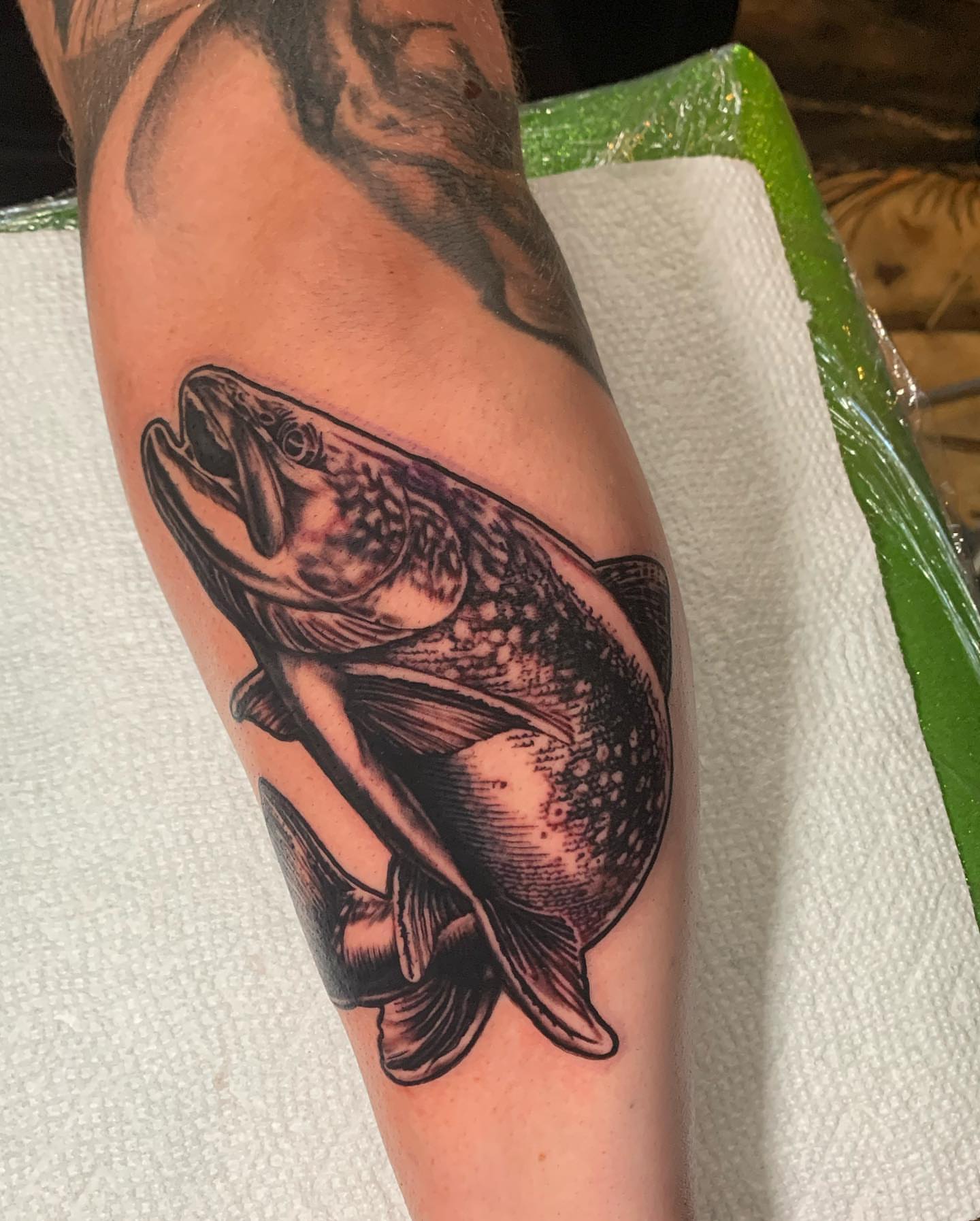 Fish realism tattoo on the forearm by james padelt