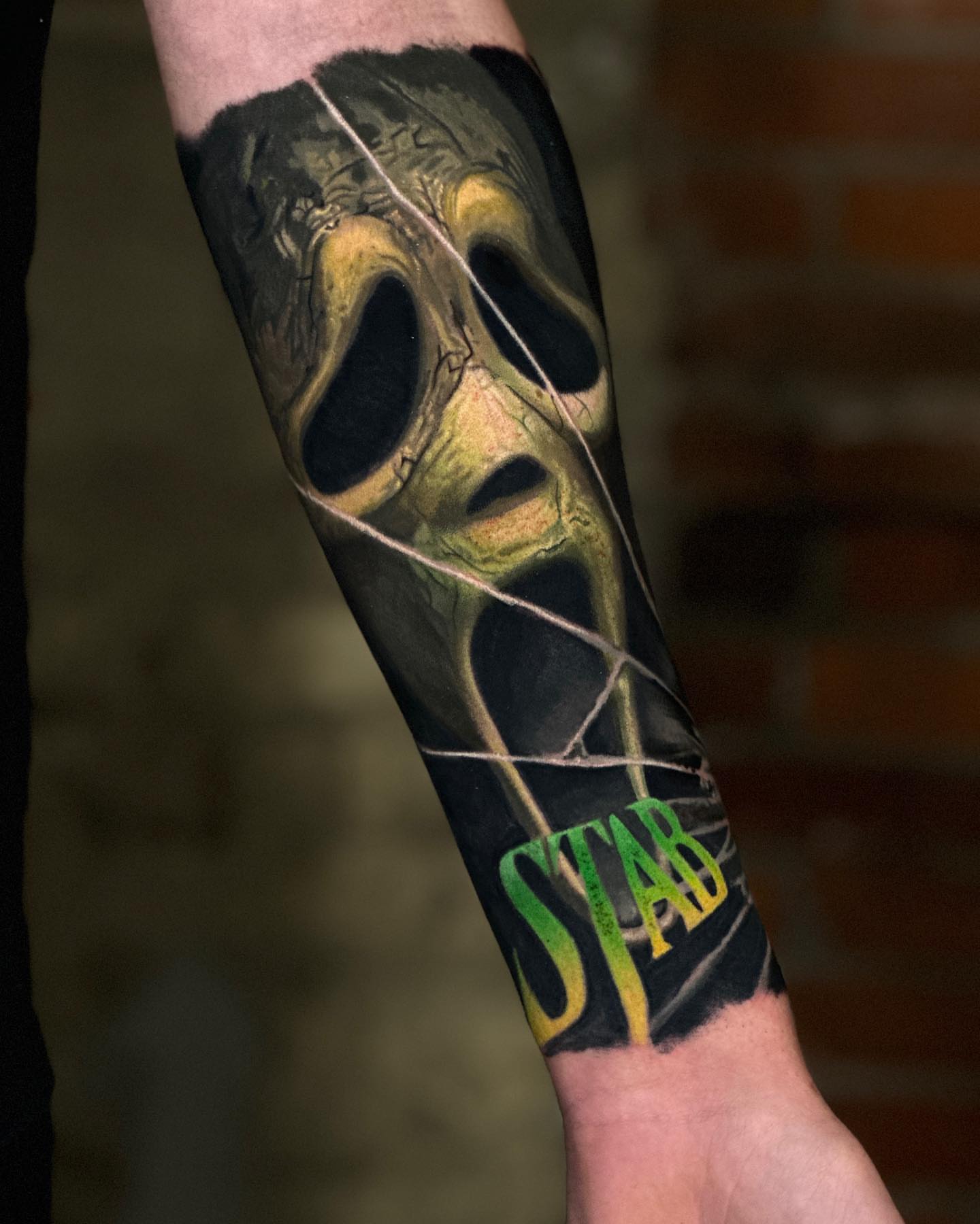 Mask realism tattoo on the forearm by Robert Morton, Cleveland, Ohio