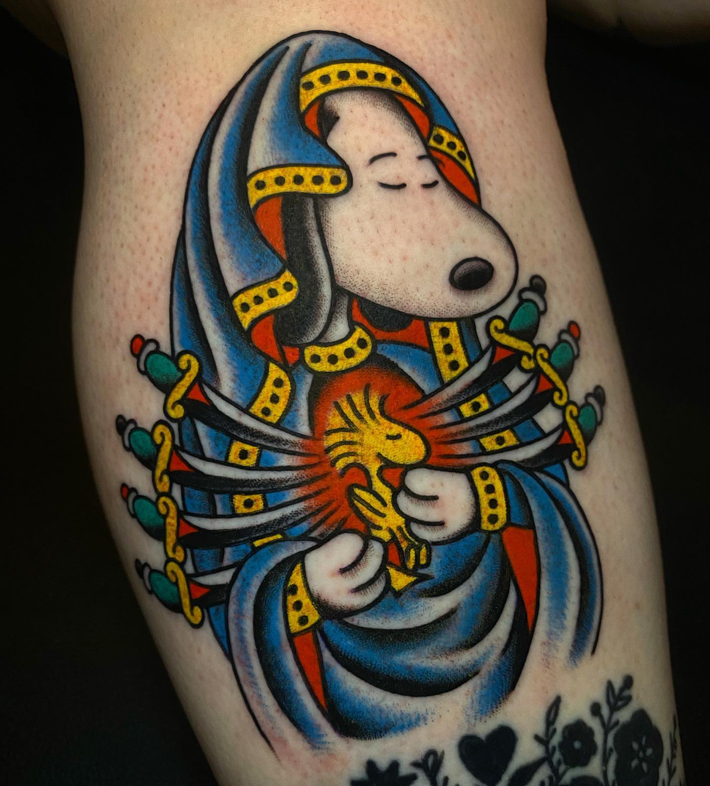 Snoopy American traditional tattoo on the forearm by Britney Goodman
