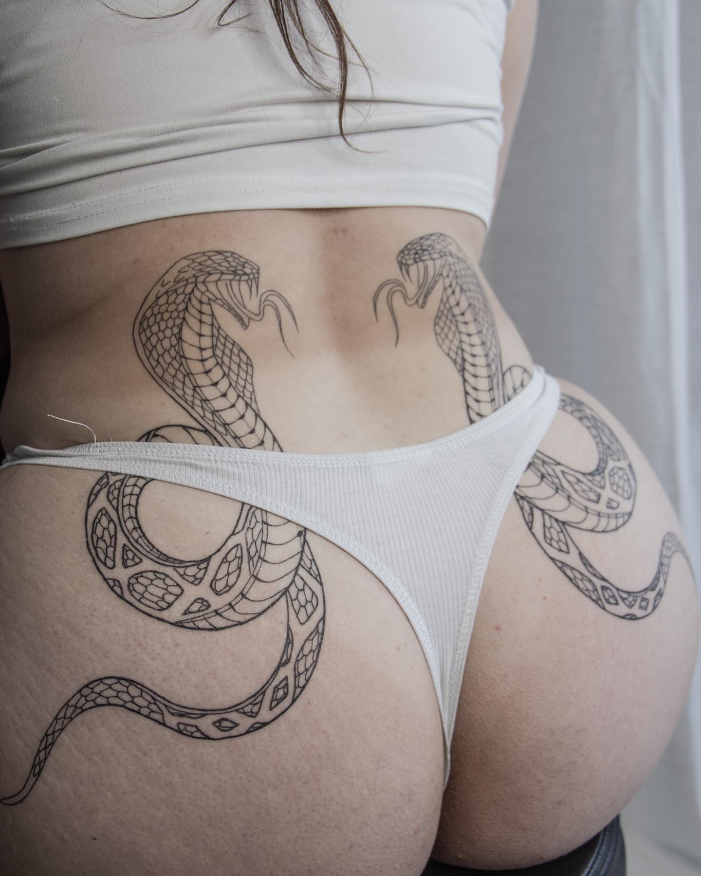 Snake black and grey tattoo on the thigh by Liv