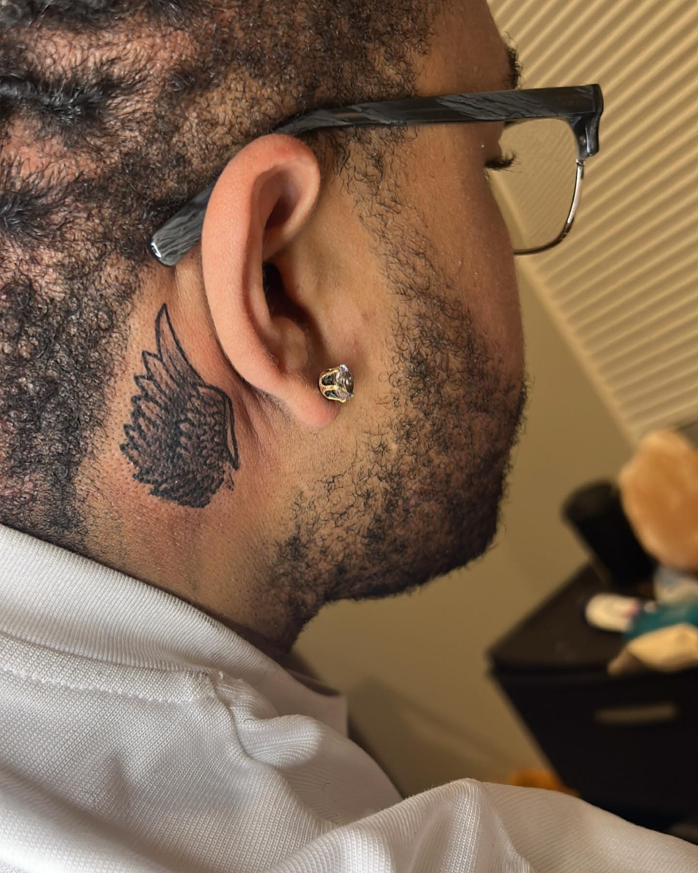 Wing black and grey tattoo on the neck by ๐ฆ