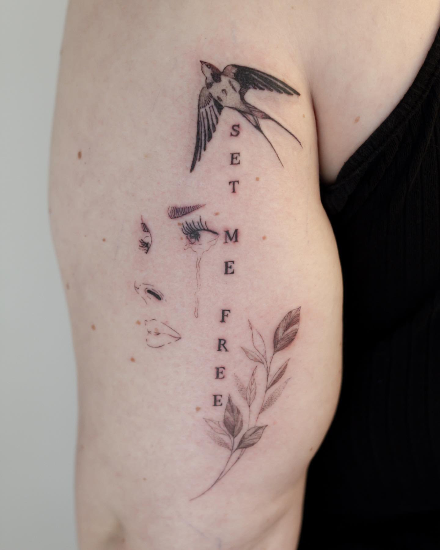 Swallow and text black and grey tattoo on the forearm by Liv