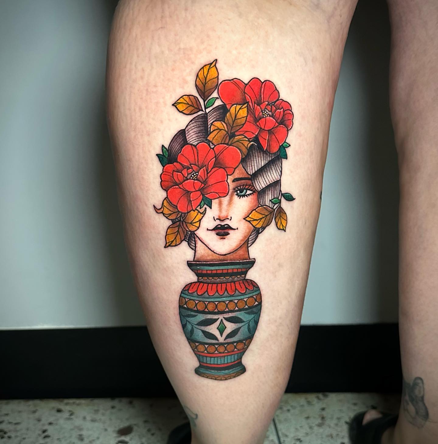 Floral vase new school tattoo on the thigh by Megan McKee Tattoo Artist