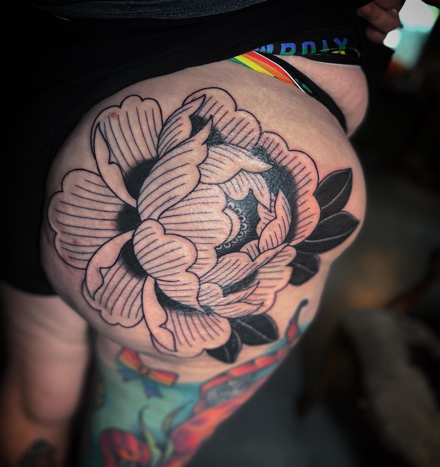 Peony American traditional tattoo on the thigh by alexandra
