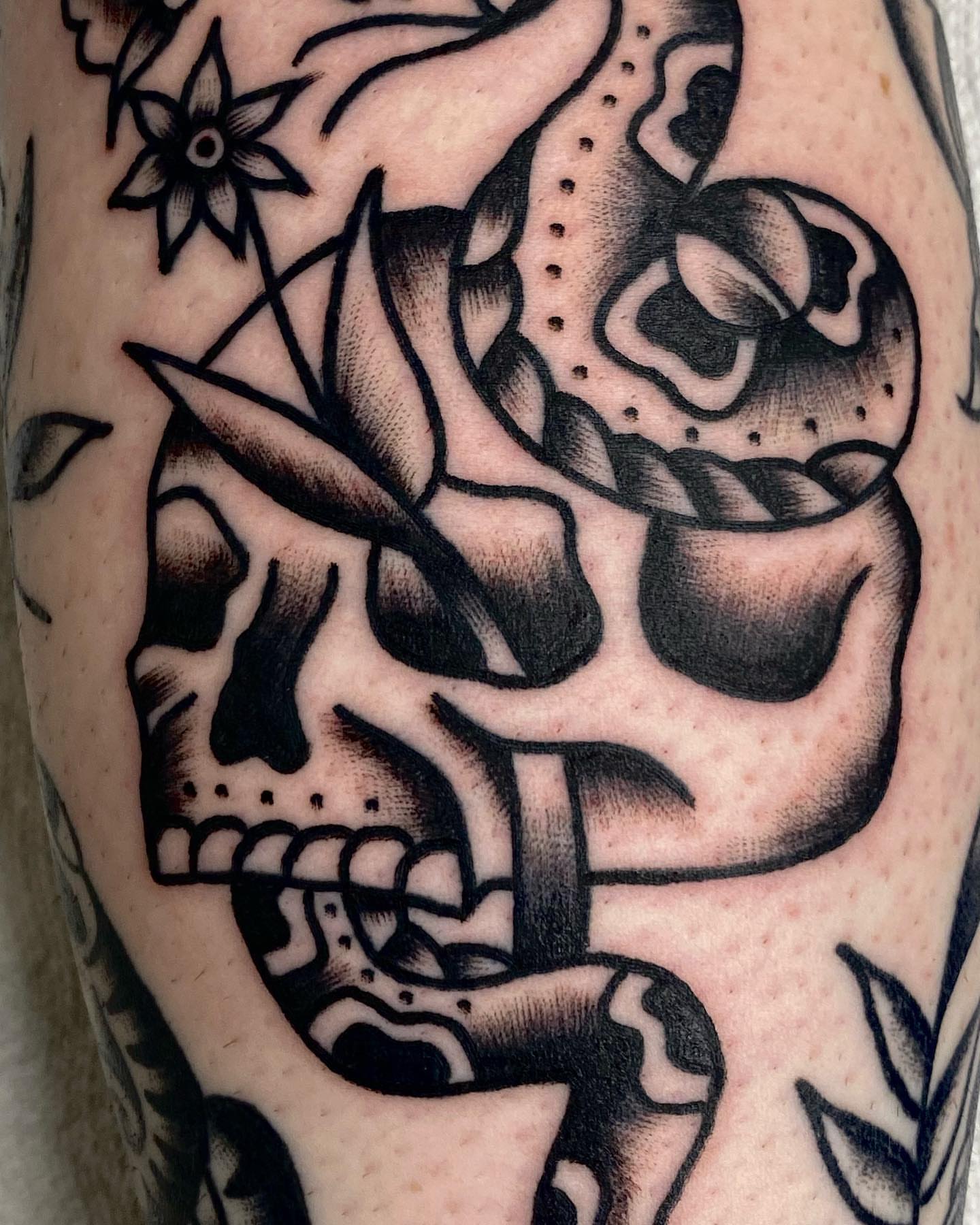 Skull with snake American traditional tattoo on the forearm by Dorian Grey Baker