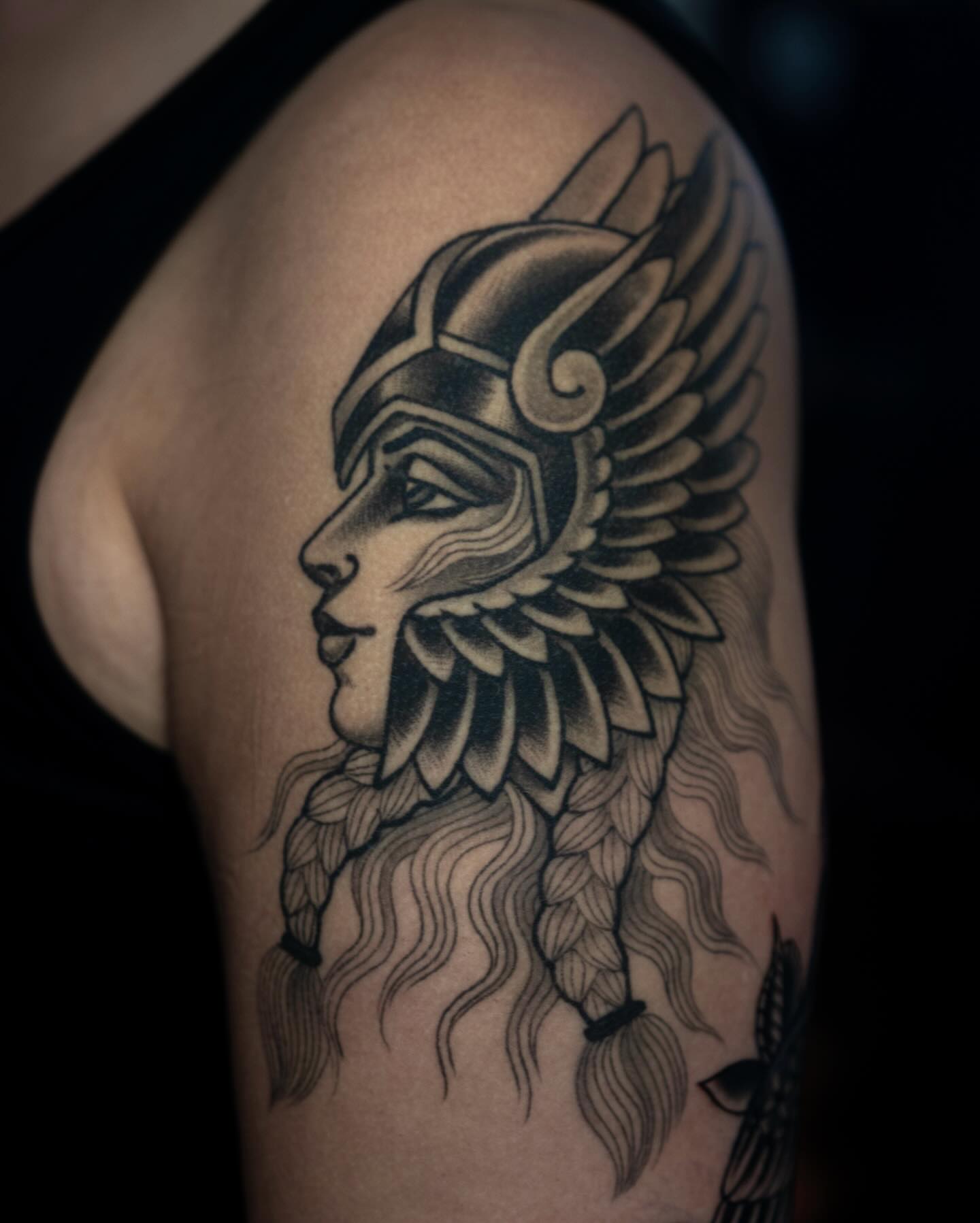 Warrior helmet black and grey tattoo on the shoulder by Danny Derrick, San Luis Obispo, California