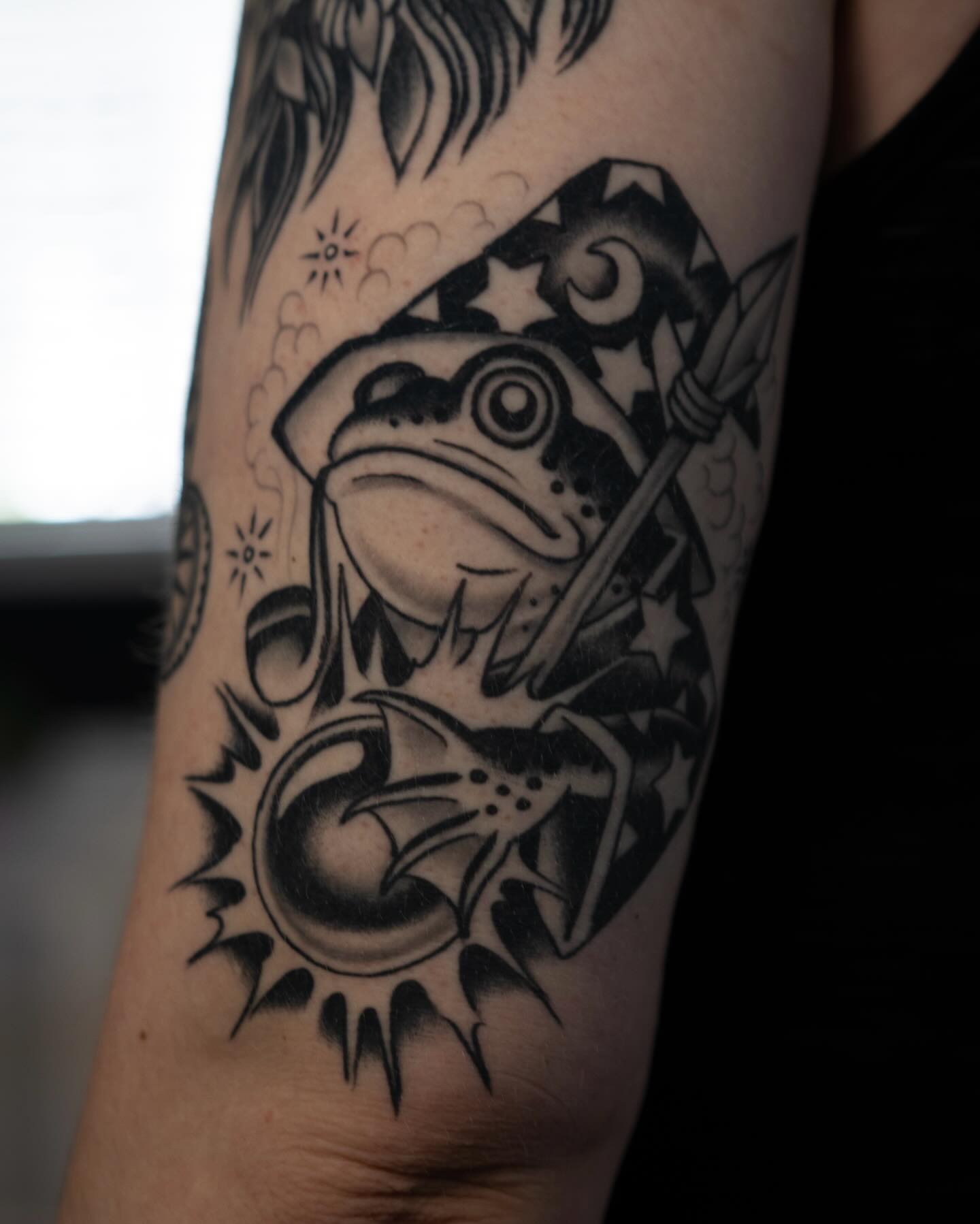 Frog with hat and bat American traditional tattoo on the forearm by Danny Derrick, San Luis Obispo, California