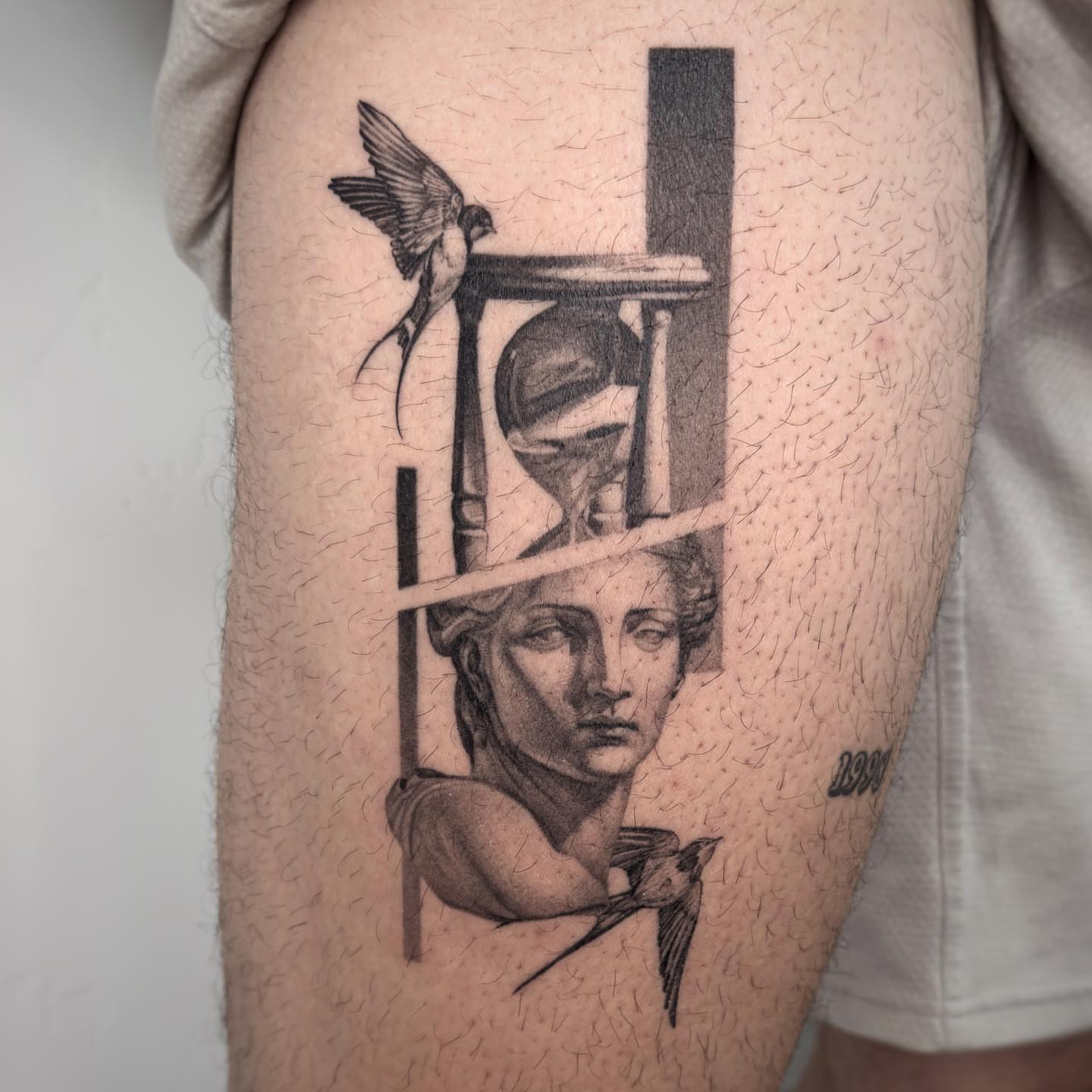 Statue with birds realism tattoo on the thigh by Paige Jean