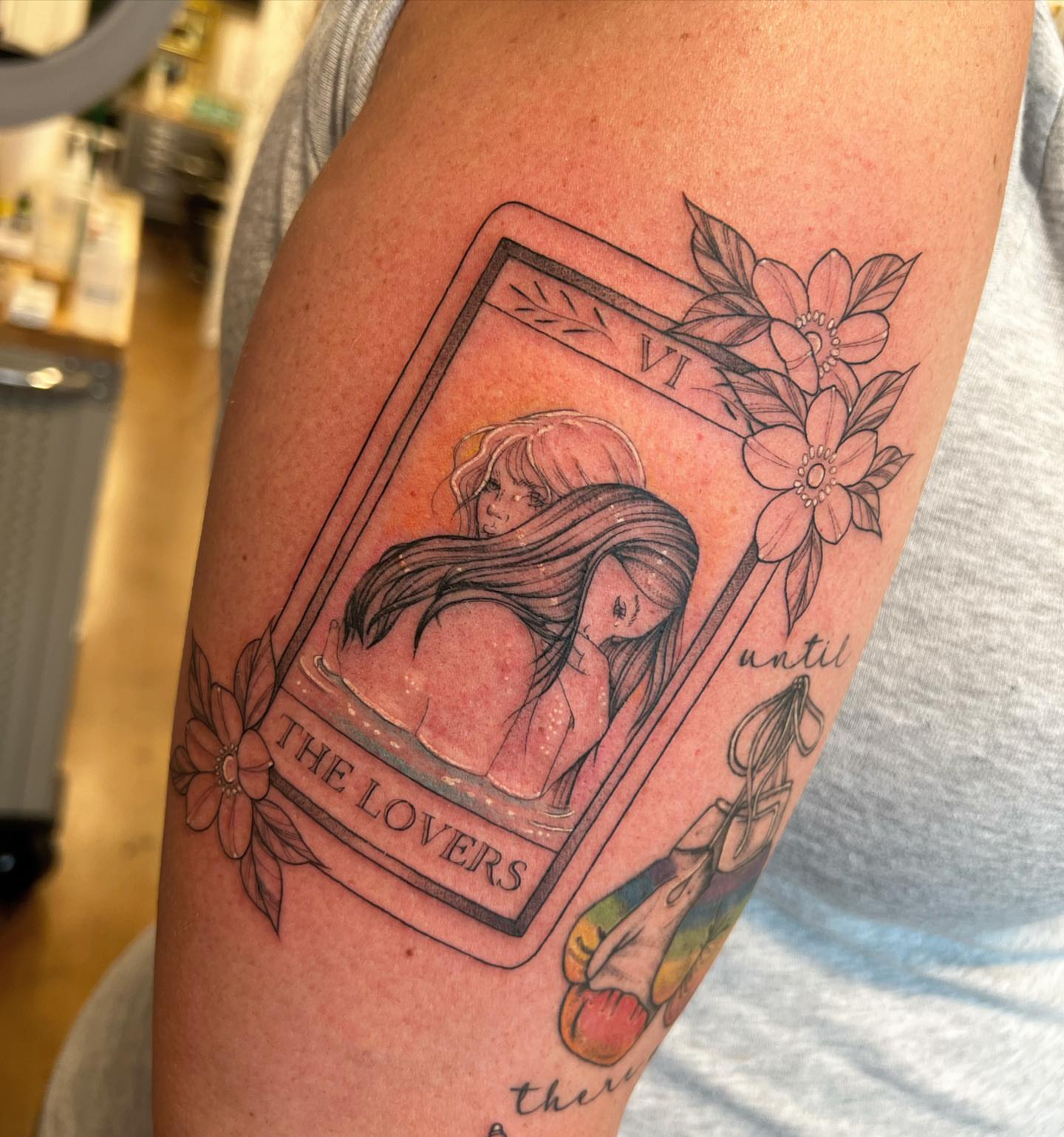 The lovers tarot card realism tattoo on the upper arm by ✨ Jaden Belle Tattoos ✨