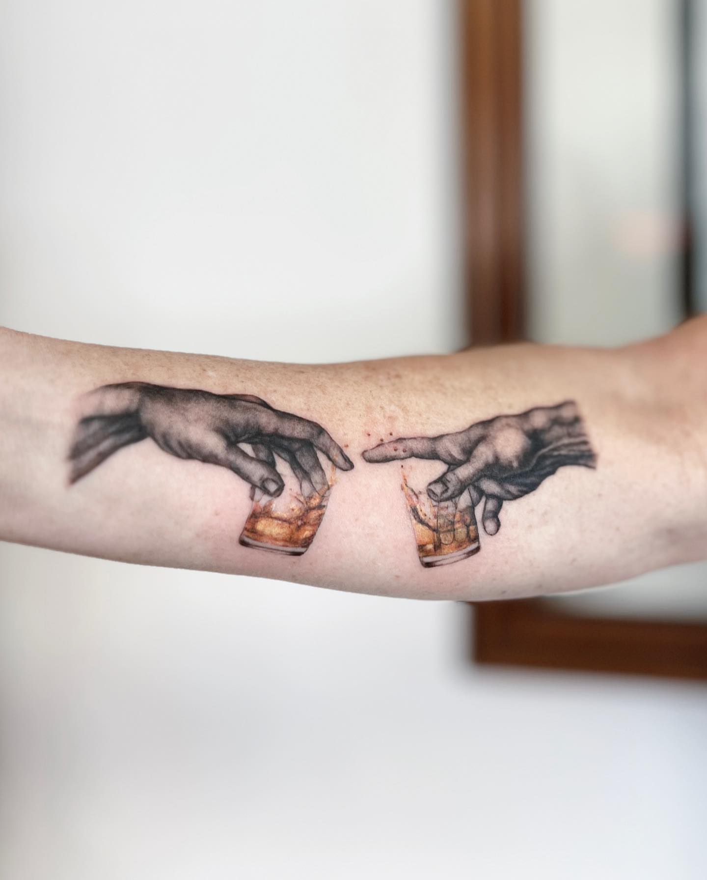 Hands and drinks realism tattoo on the forearm by πππ¦