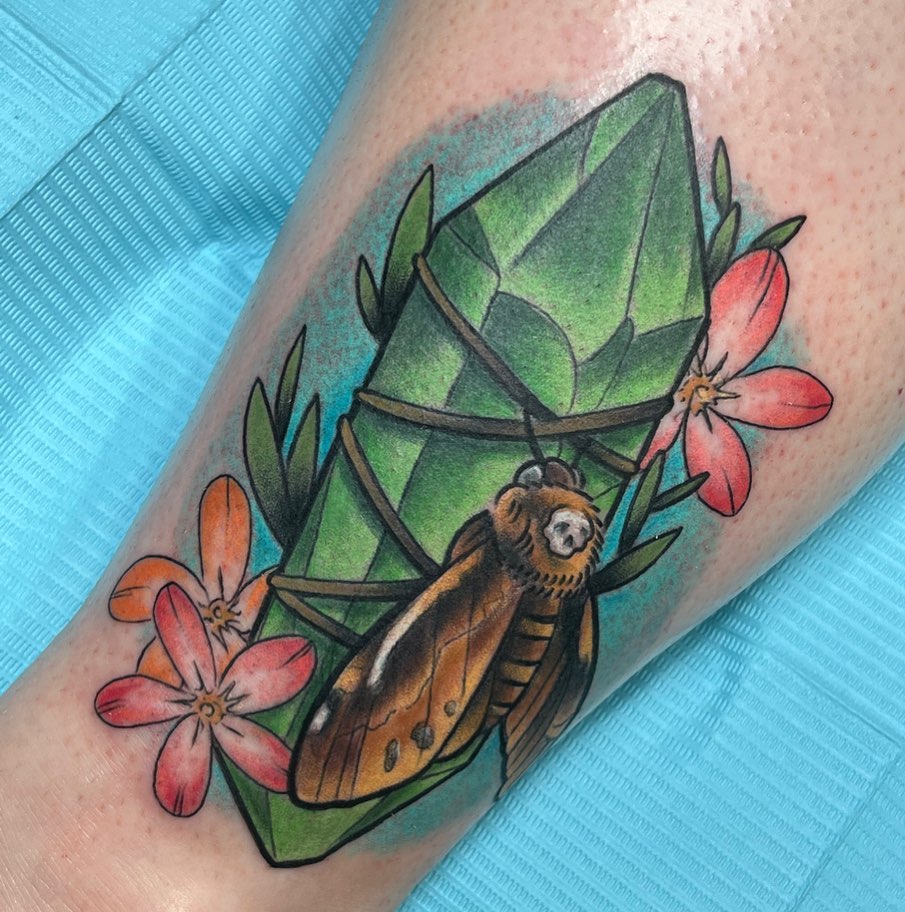 Butterfly and crystal American traditional tattoo on the forearm by Erick Campion