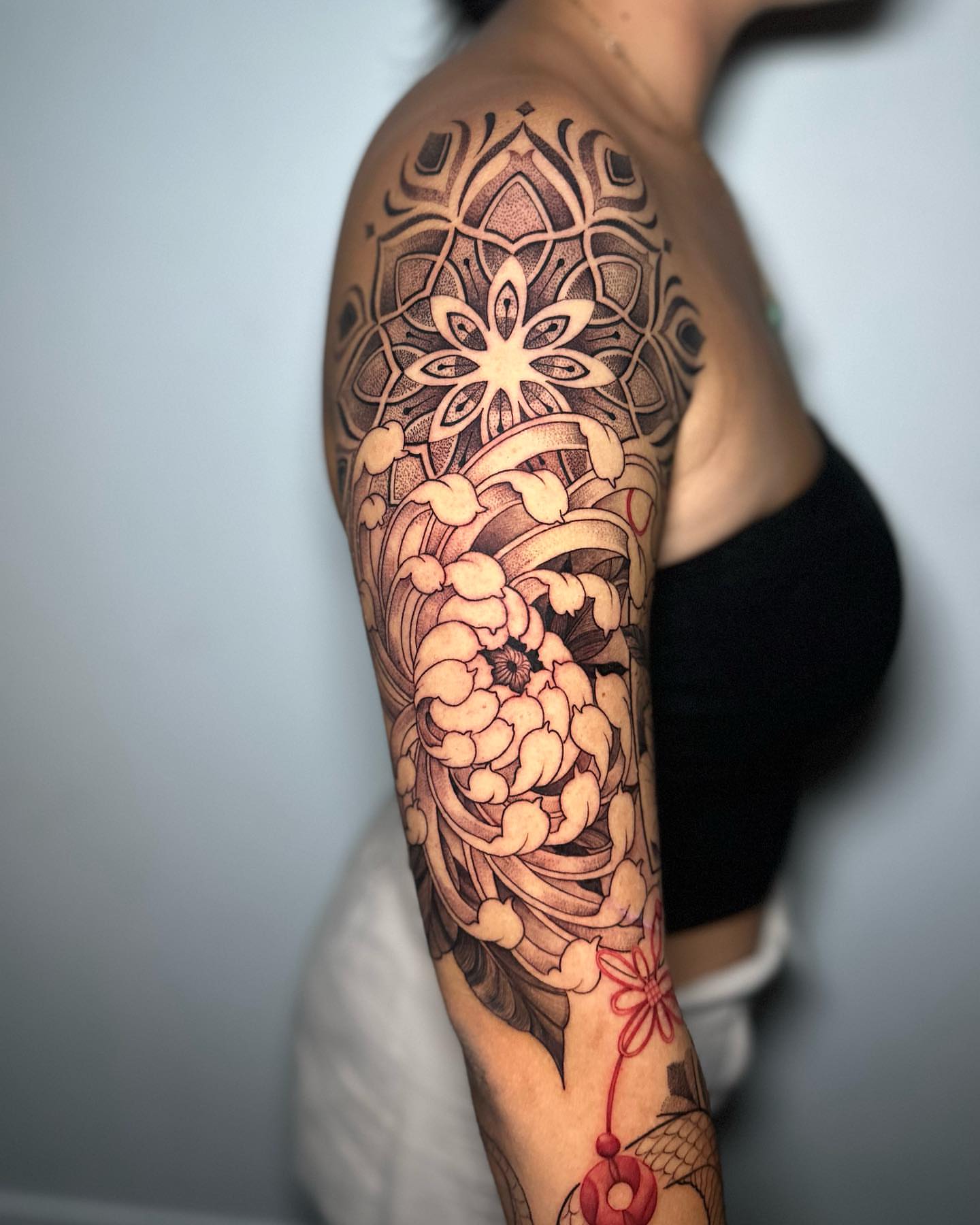 Floral mandala geometric tattoo on the upper arm by 🇵🇭Mark Gaño