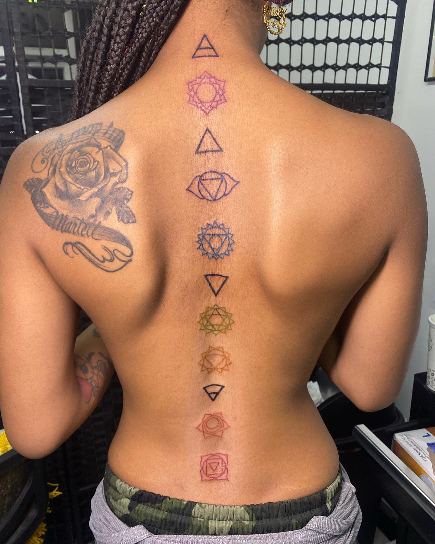 Chakra symbols geometric tattoo on the back by Visionary🌌