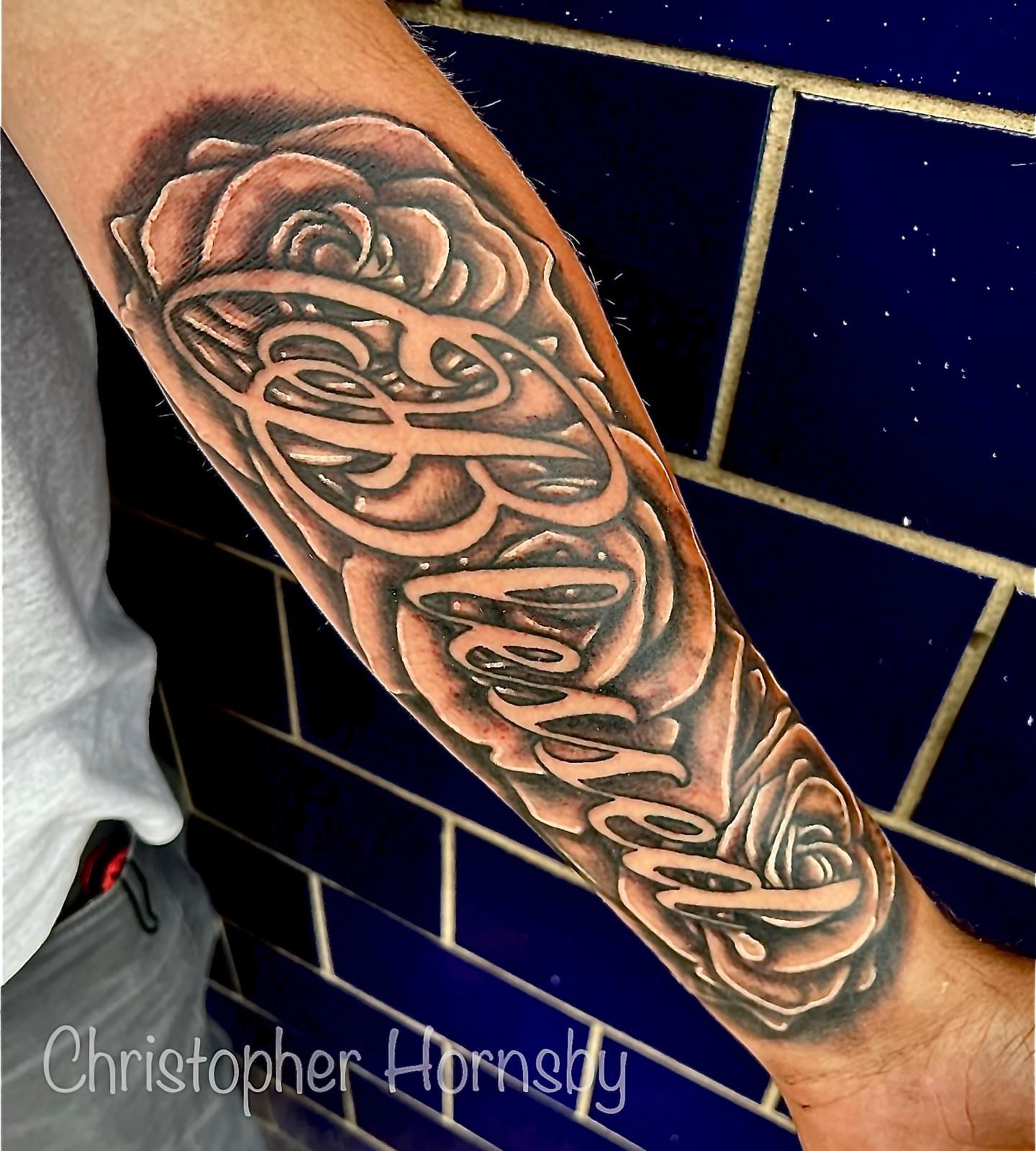 Rose and celtic knot realism tattoo on the forearm by Chris Hornsby