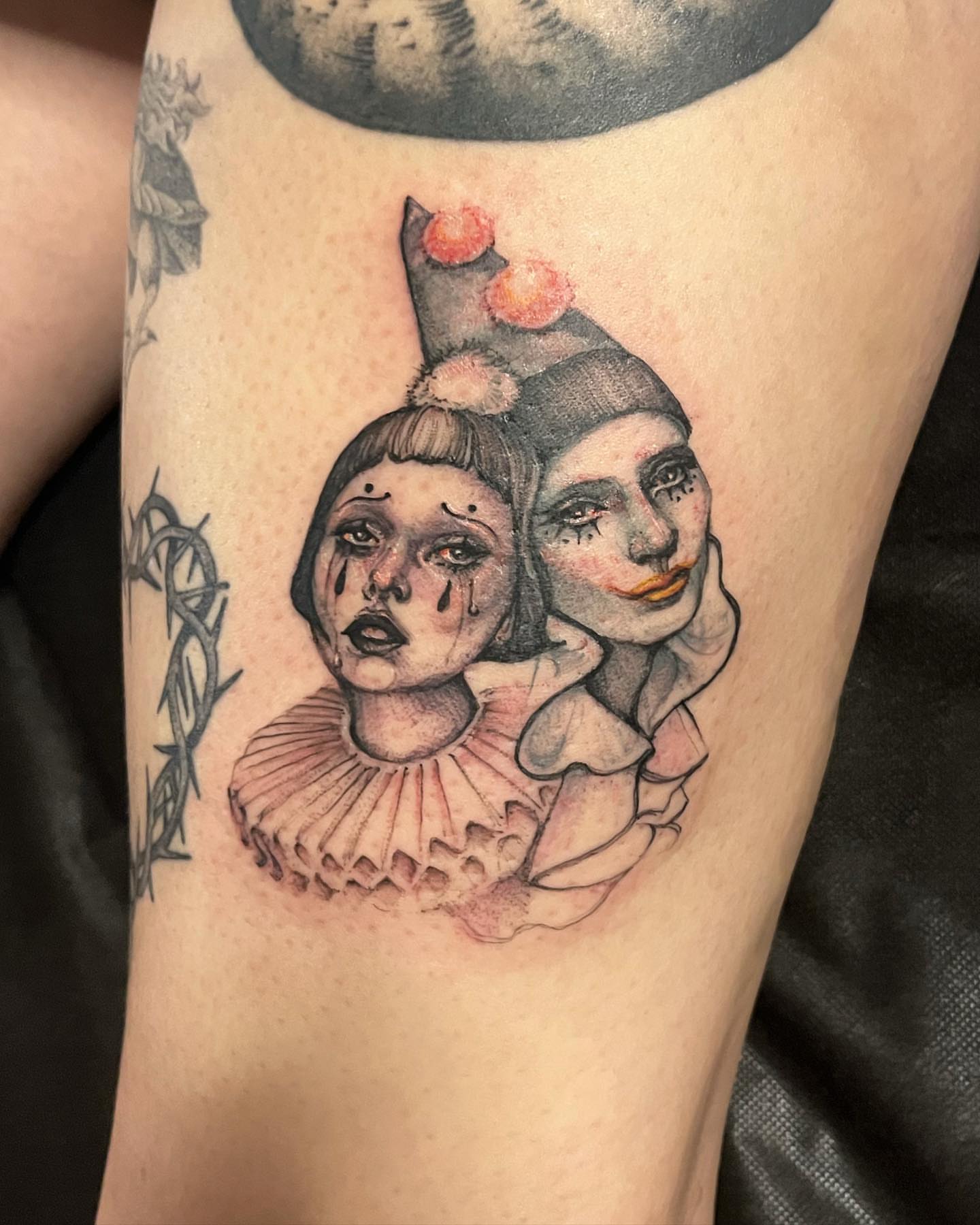 Clown faces realism tattoo on the forearm by Sarah Spread