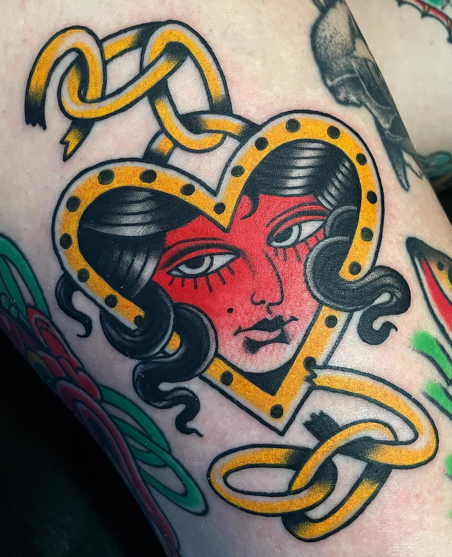 Woman's face with snakes American traditional tattoo on the forearm by Frank Mostek