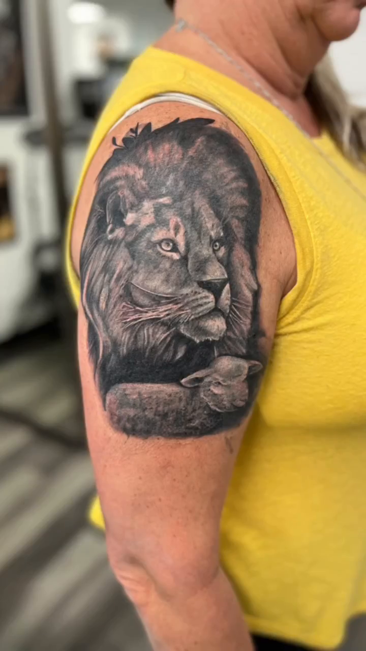 Lion portrait realism tattoo by Look