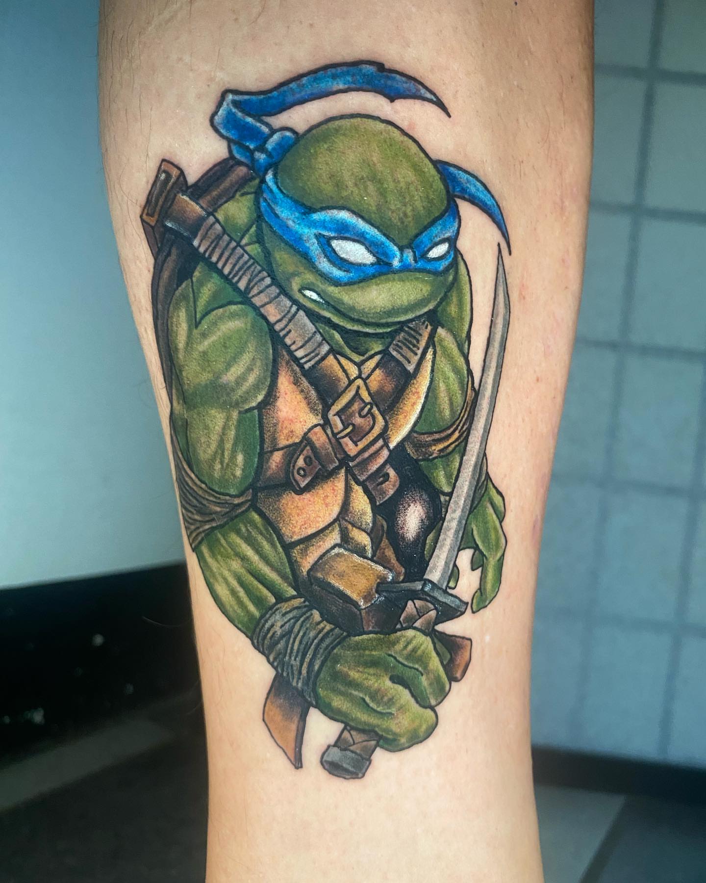 Teenage mutant ninja turtle realism tattoo on the forearm by Glen Wallis