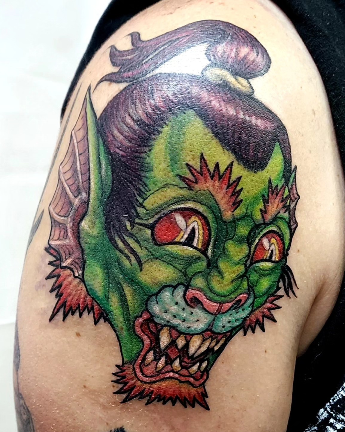 Zombie head American traditional tattoo on the shoulder by Scott Fricke