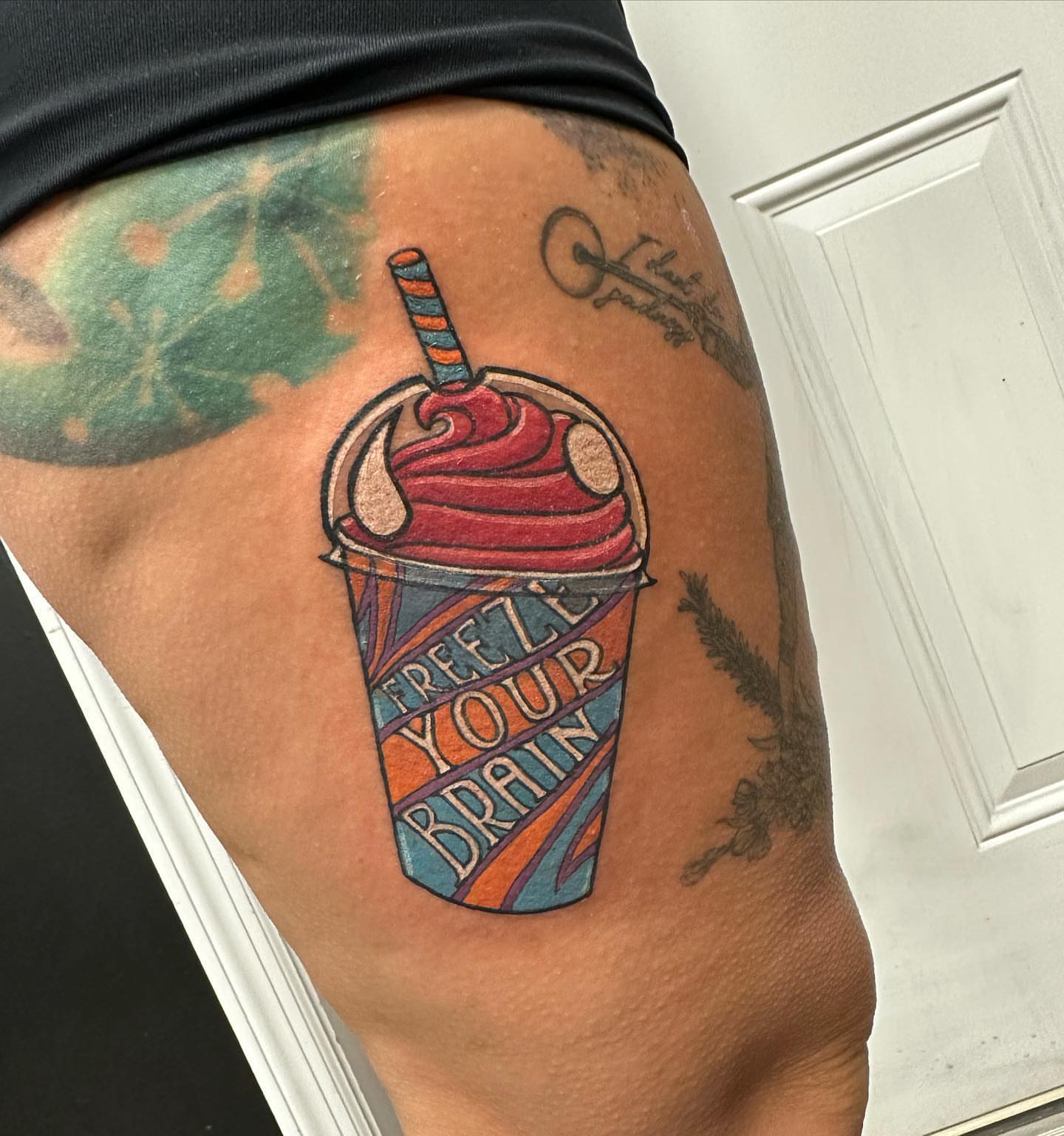 Frozen drink new school tattoo on the thigh by 𝕵𝖊𝖘𝖘𝖆 𝕭𝖎𝖌𝖊𝖑𝖔𝖜, Harrison, New Jersey