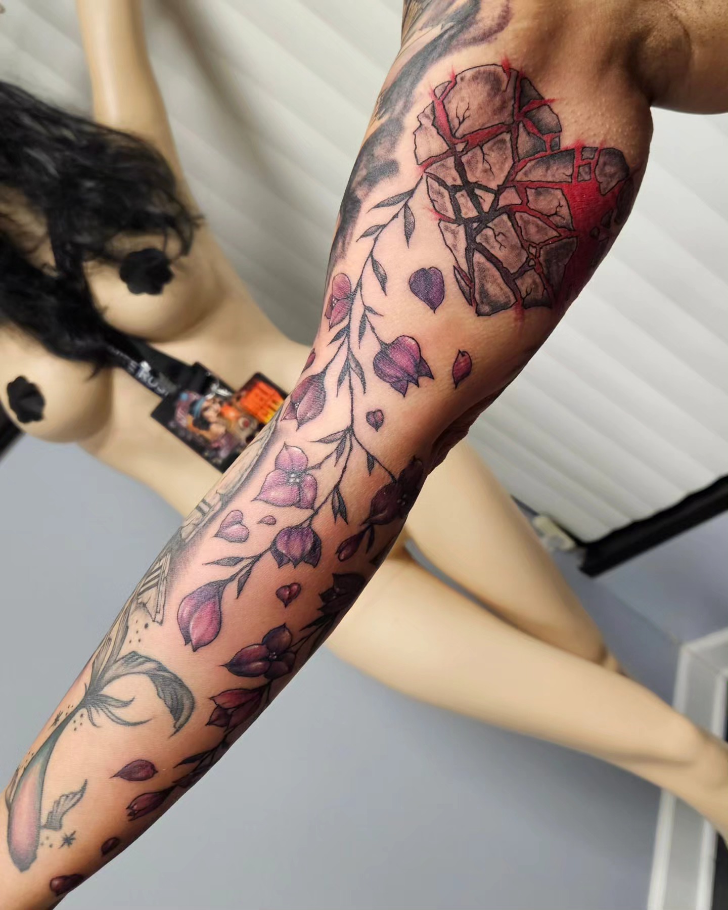 Flower and rock realism tattoo on the forearm by Chicagoland Tattoo artist - Dany Rojas