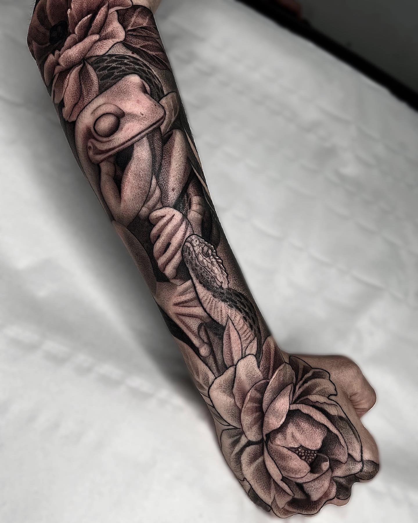 Peony and snake realism tattoo on the forearm by Enrique Martinez
