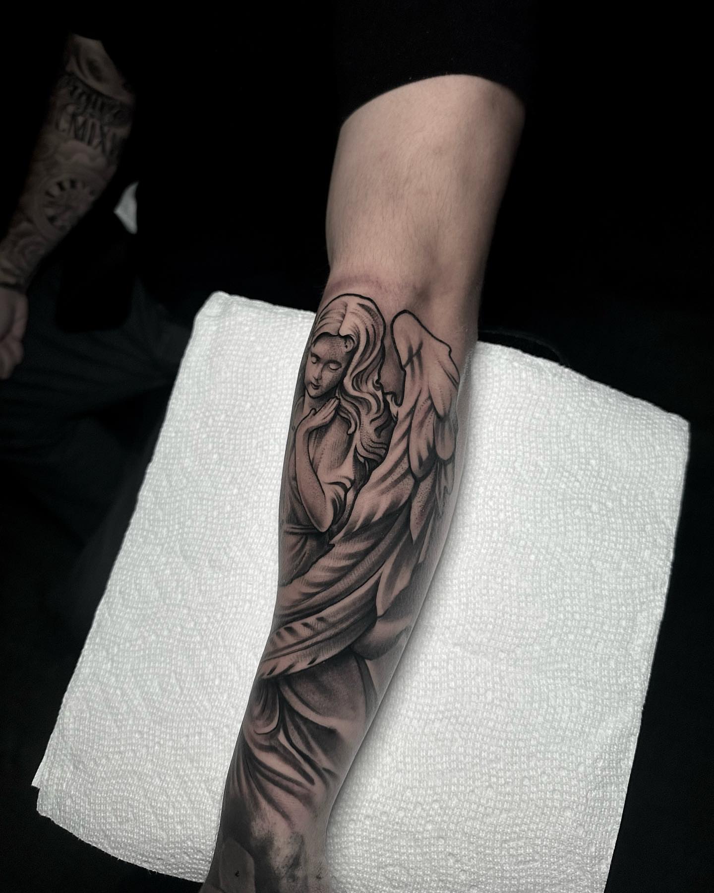 Angel black and grey tattoo on the forearm by Rawb