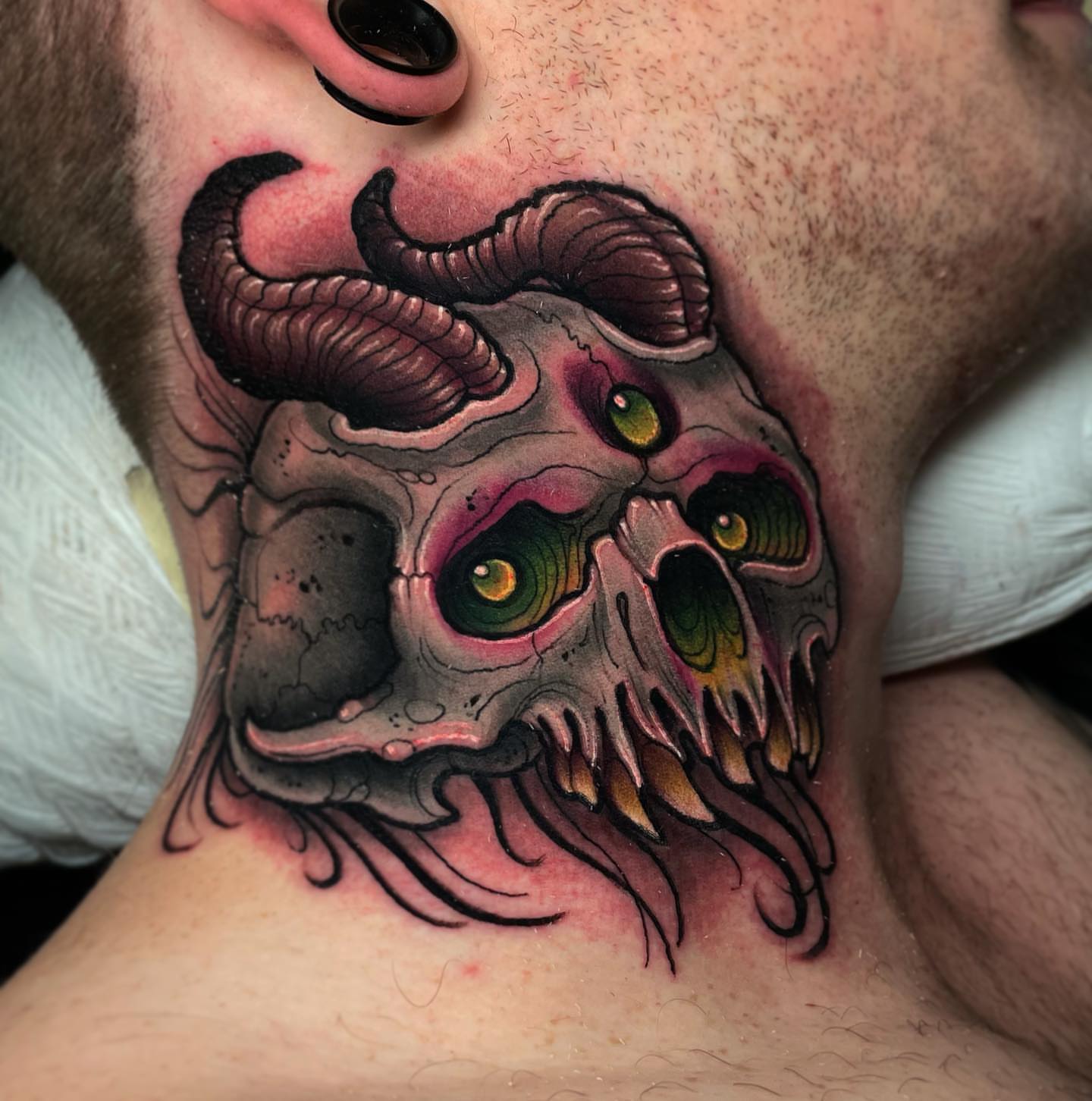 Demon skull dark realism tattoo on the neck by Ick Abrams