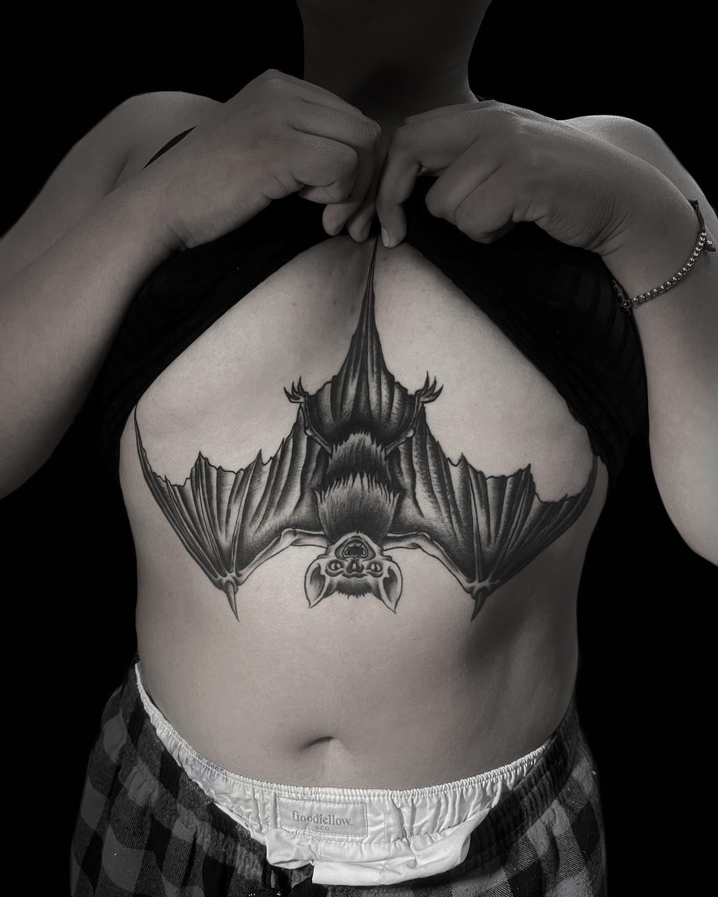 Bat black and grey tattoo on the chest by Jason