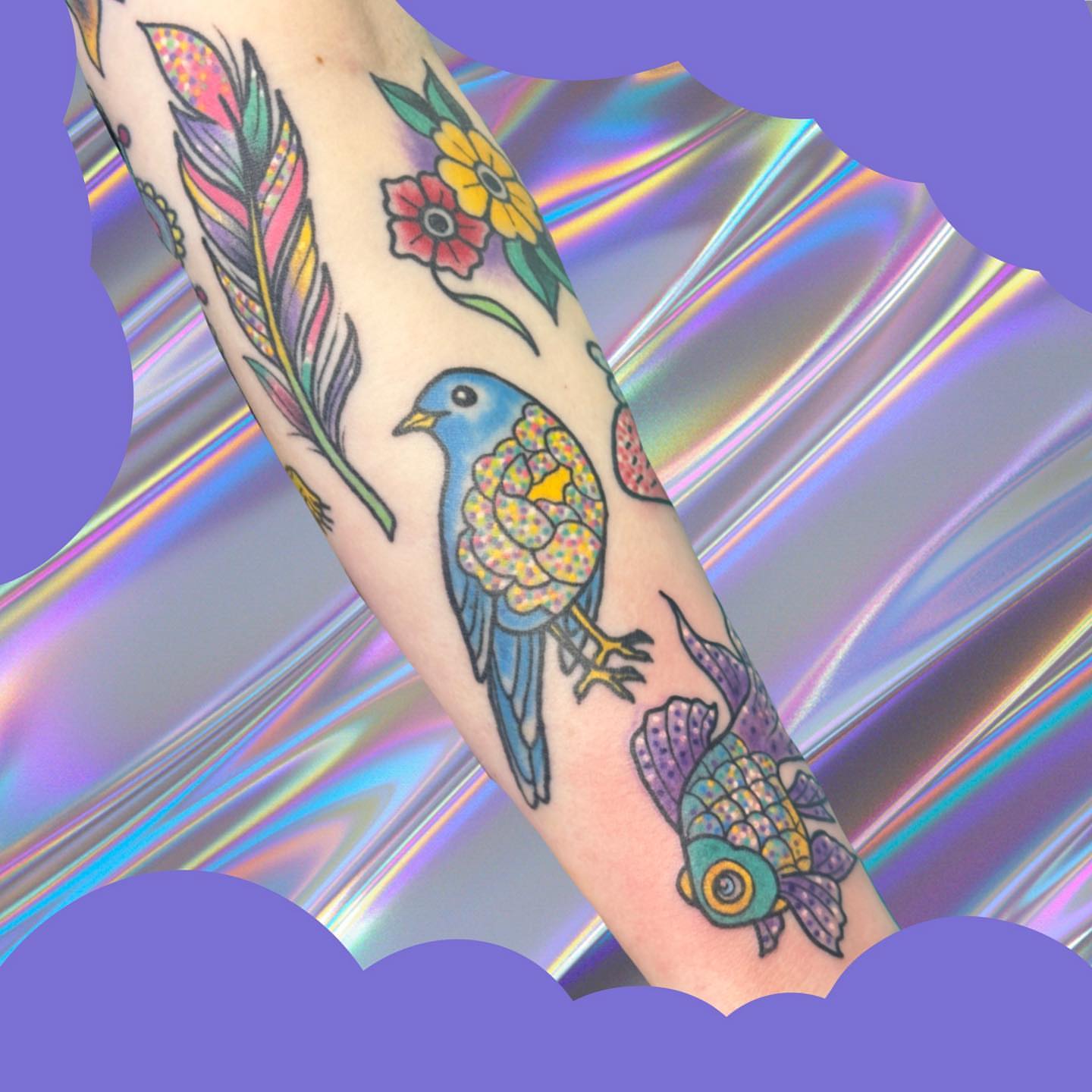 Bird and fish new school tattoo on the forearm by Chelsea Lane