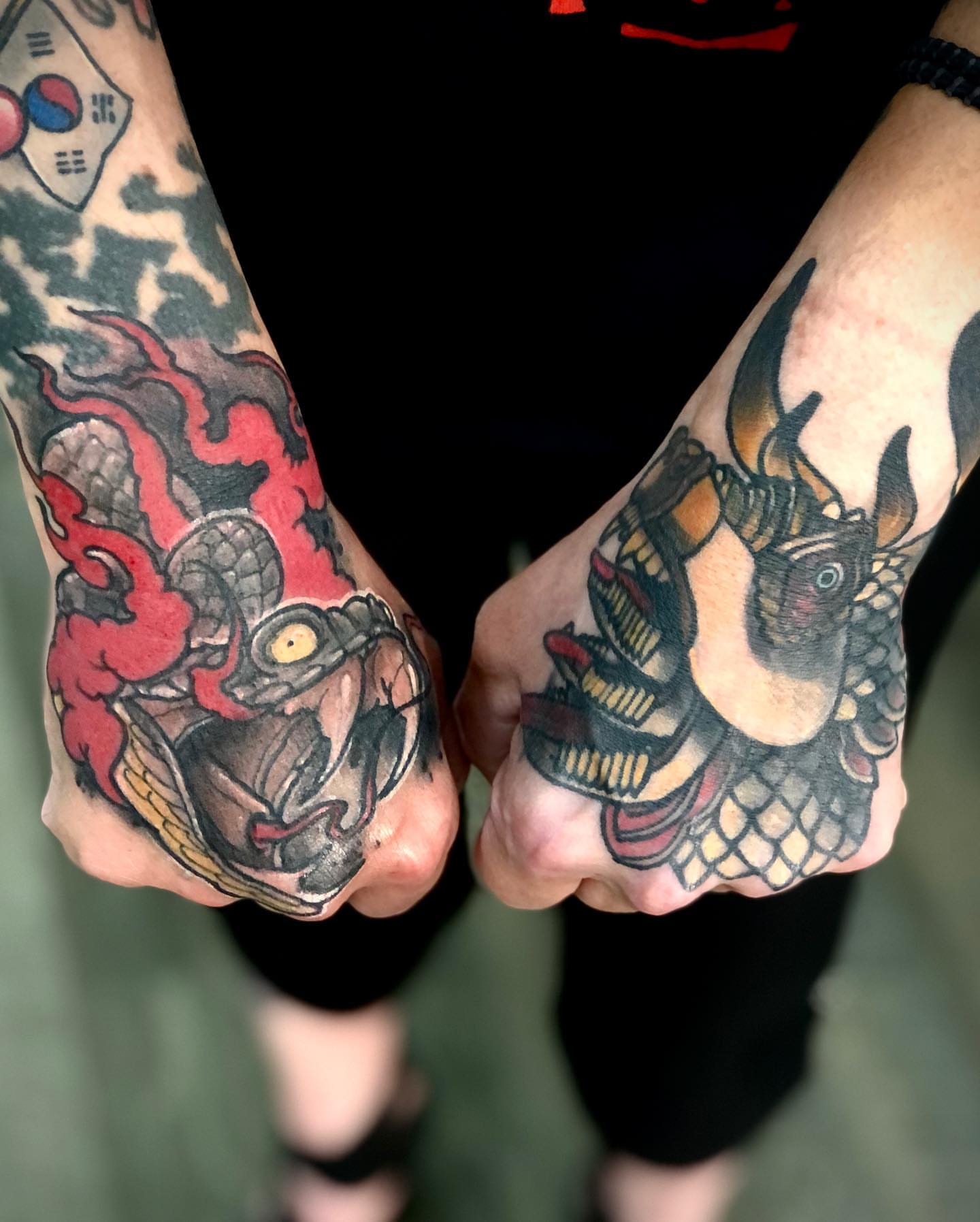 Dragon American traditional tattoo on the hand by Alec Bauer