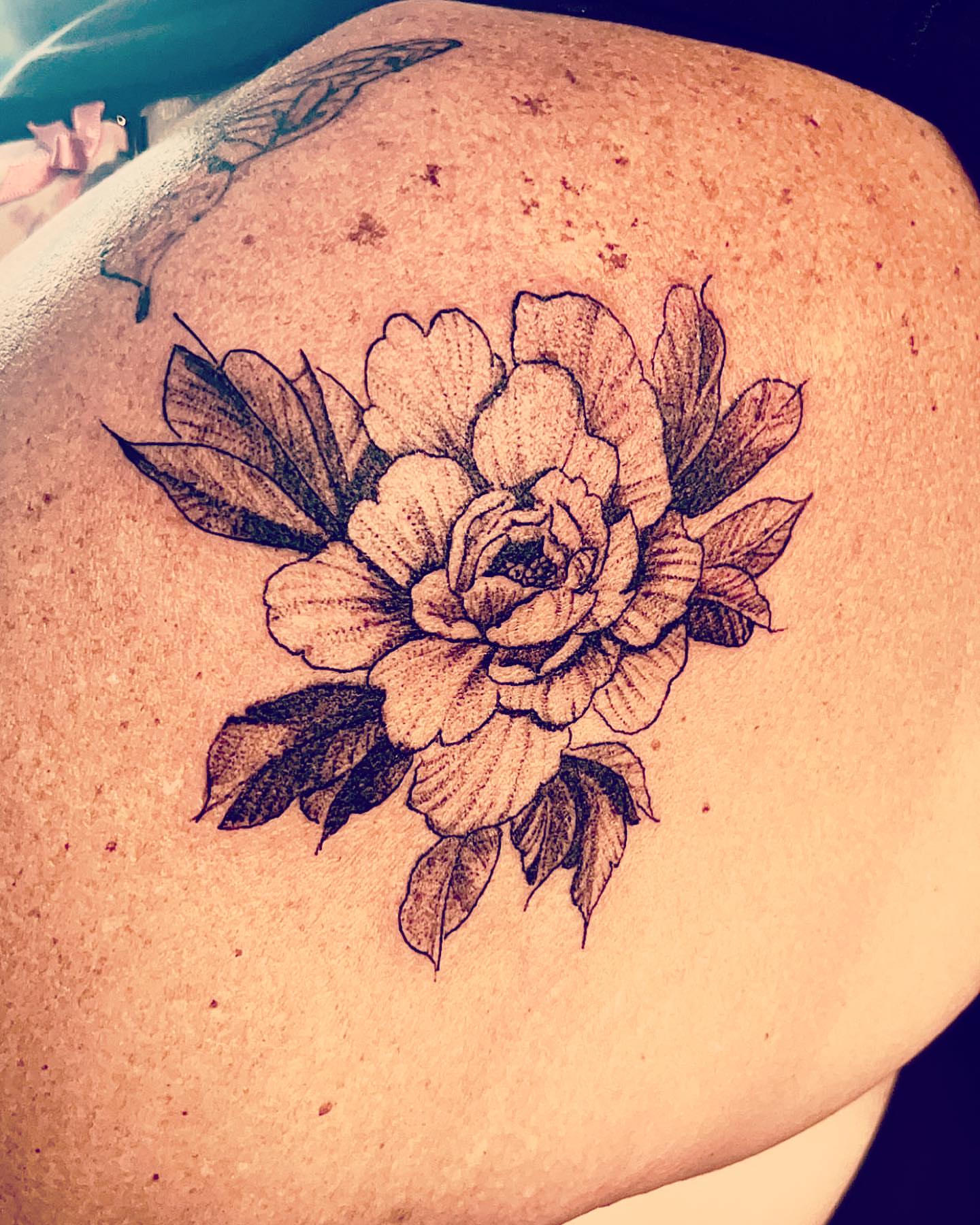 Peony dotwork tattoo on the shoulder by Dre Ortiz