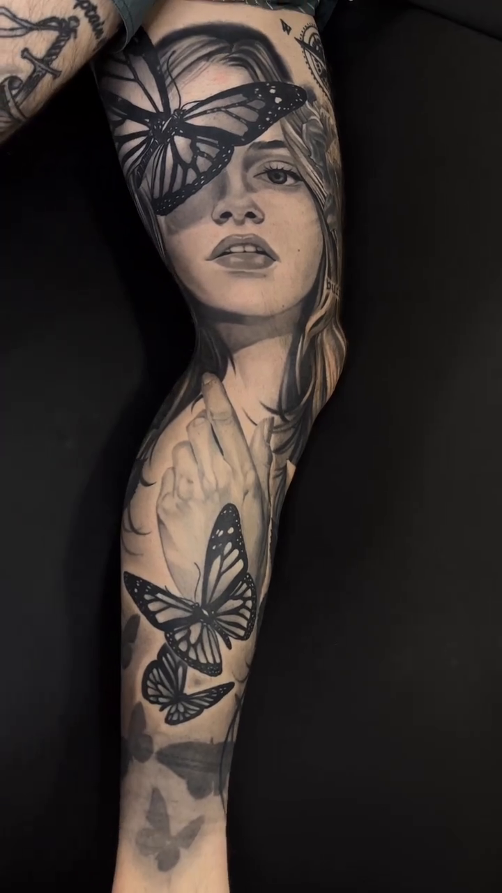 Woman with butterflies realism tattoo by Bradley Dozier