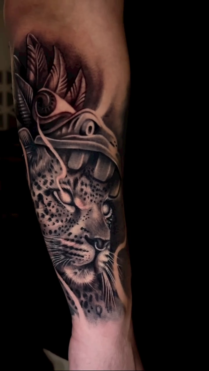 Leopard head with headdress realism tattoo by Ana Reyes