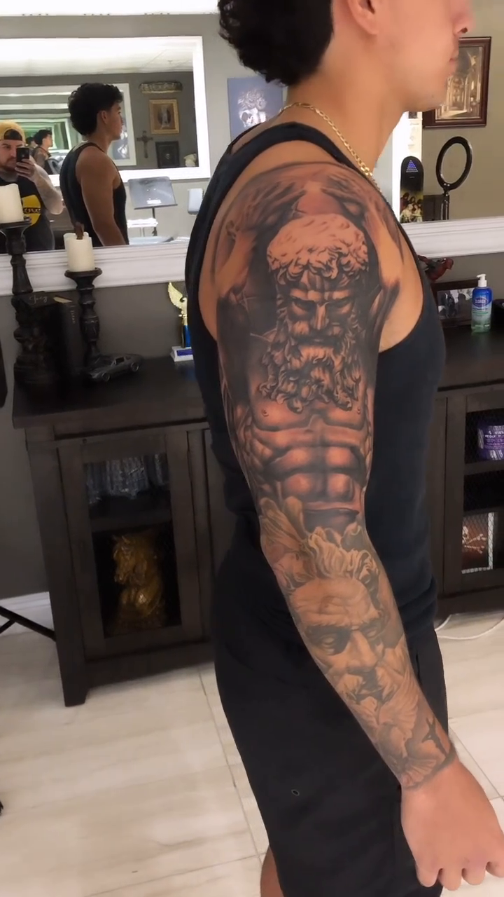Greek god portrait on arm realism tattoo by Danny Rodriguez