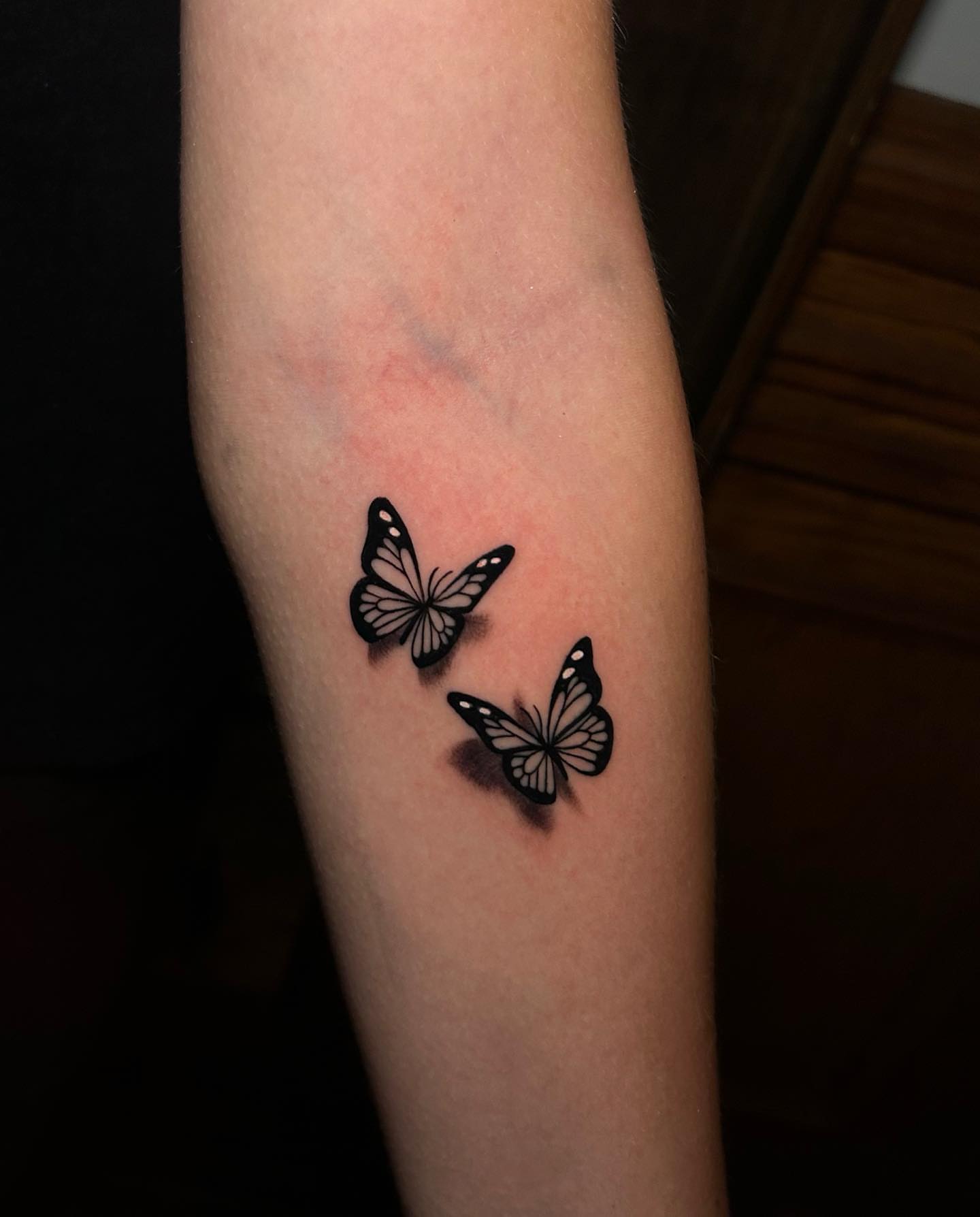 Butterflies black and grey tattoo on the forearm by Josy Castro