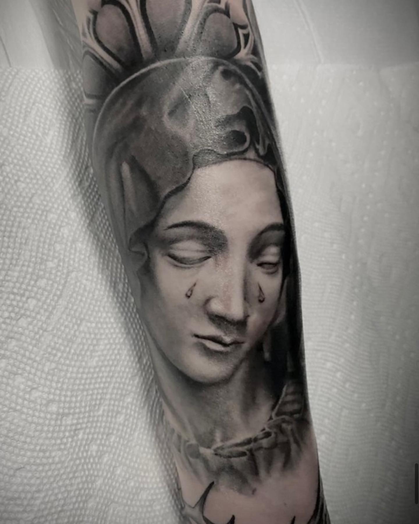 Woman's face realism tattoo on the forearm by Douglas