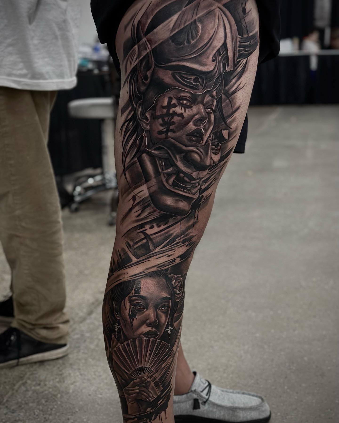 Geisha and warrior realism tattoo on the forearm by Aaron Watson