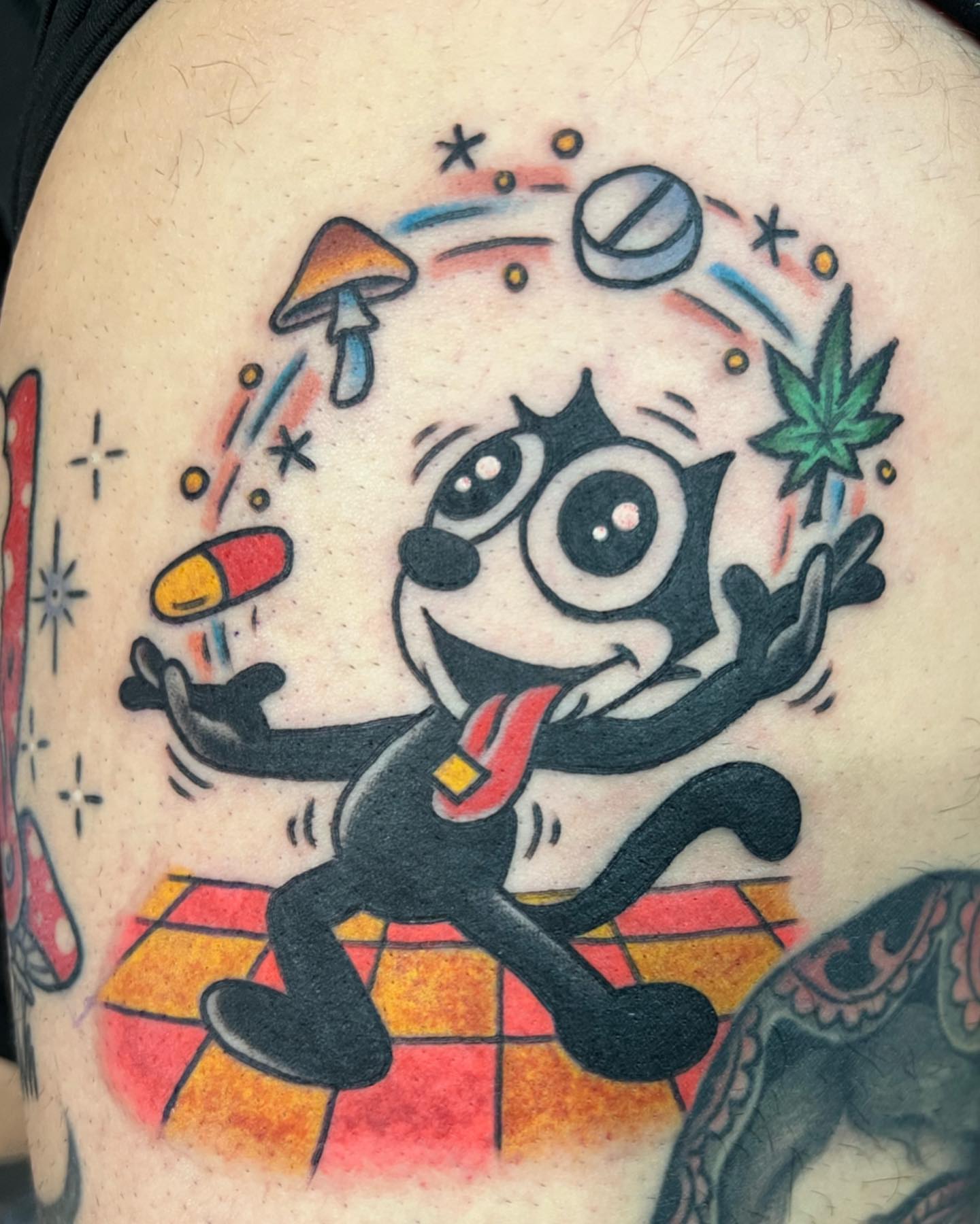Pennywise American traditional tattoo on the shoulder by Ross K. Jones Tattoos, San Francisco, California