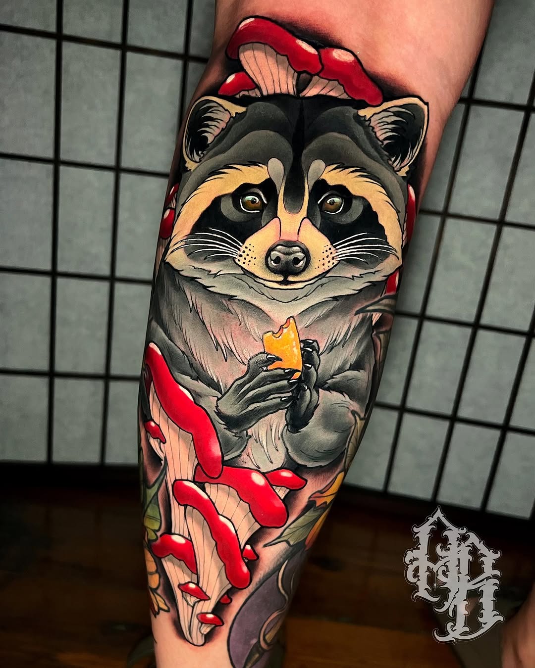 Raccoon with mushrooms American traditional tattoo on the forearm by Austin Britt