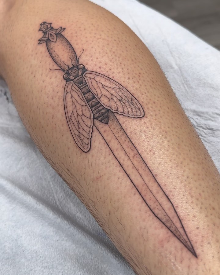 Knife with insect black and grey tattoo on the forearm by ꧁༒