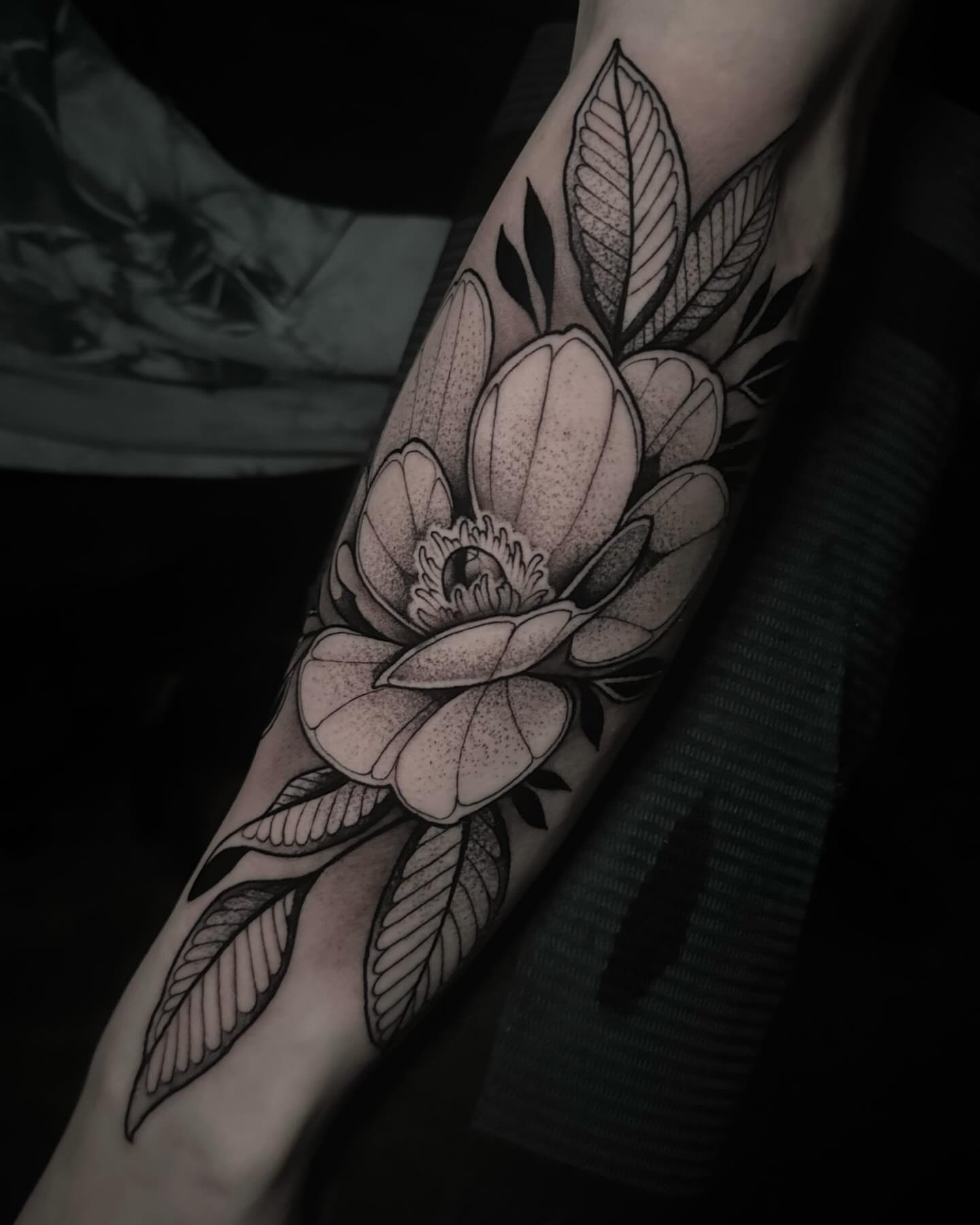 Flower black and grey tattoo on the forearm by Clayton Smith (BEAR)