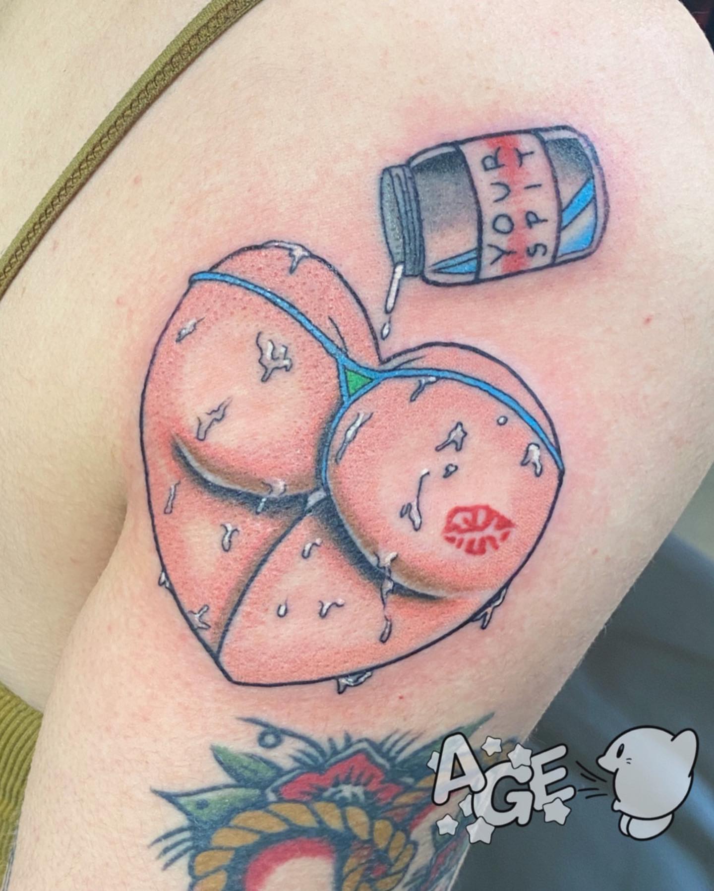 Heart with spilled jar realism tattoo on the thigh by Otaku and Gamer Tattooer