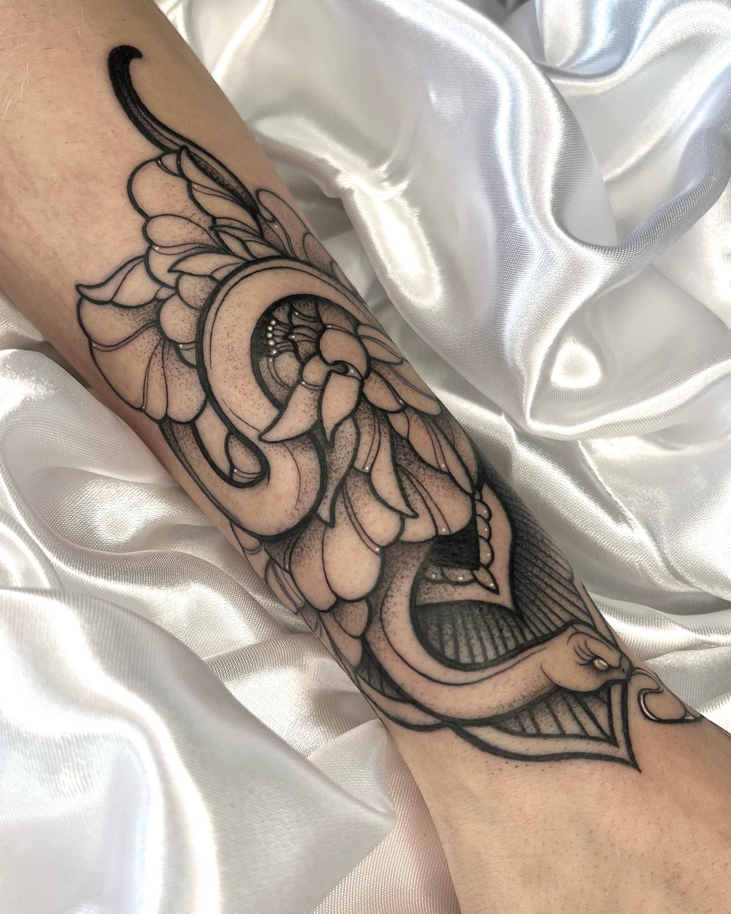 Serpent dotwork tattoo on the forearm by Gabrieli Folha
