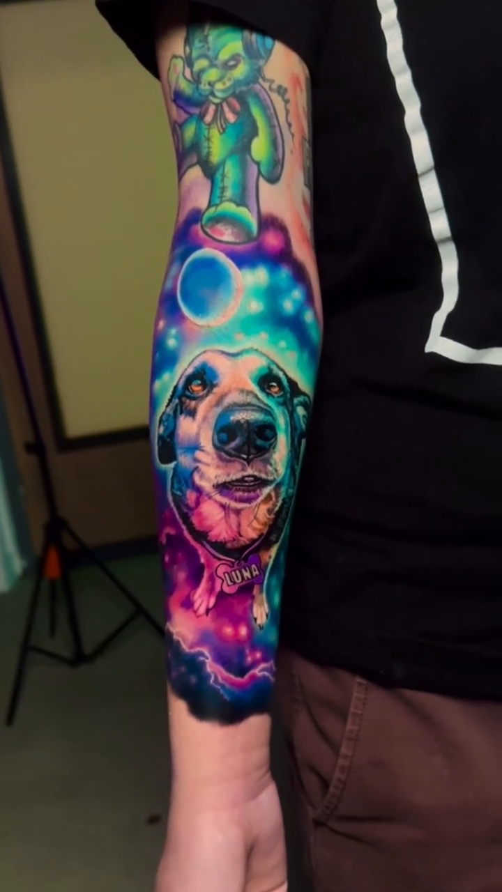 Dog in space realism tattoo by Bobby Cupparo