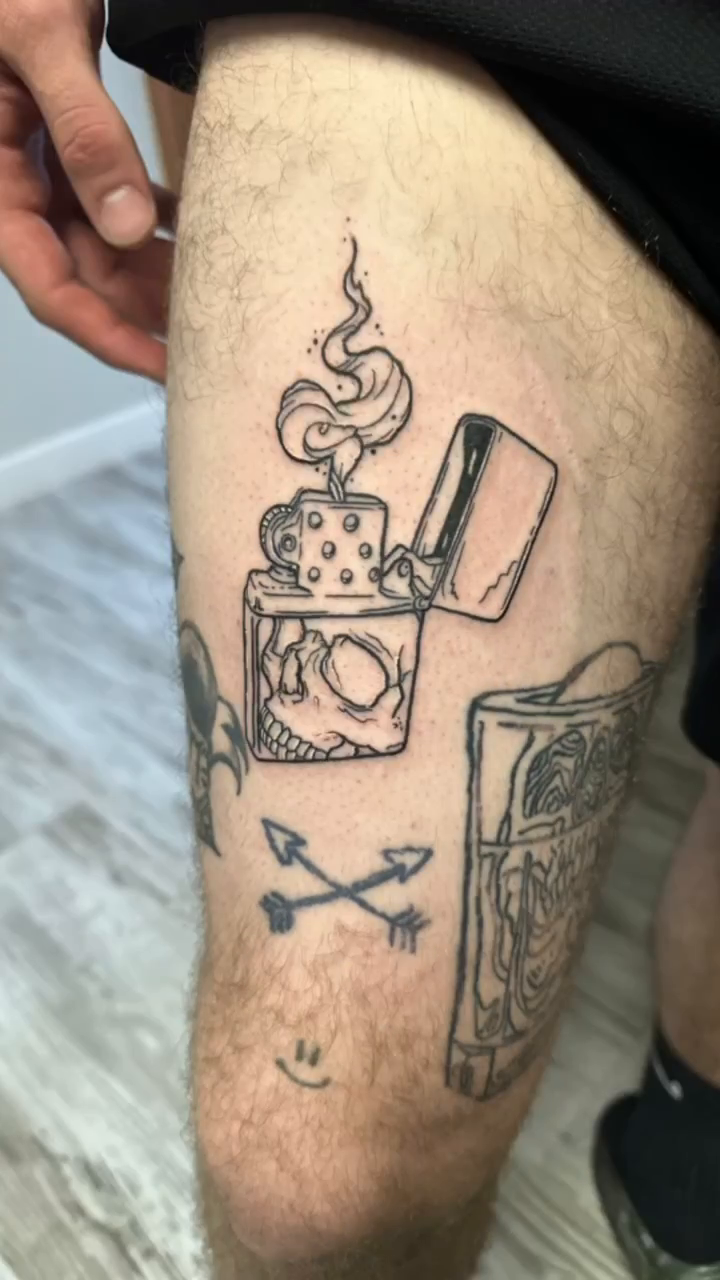Lighter with flames and skull minimalist tattoo on the forearm by Luis Cabrera, Cleveland, Ohio